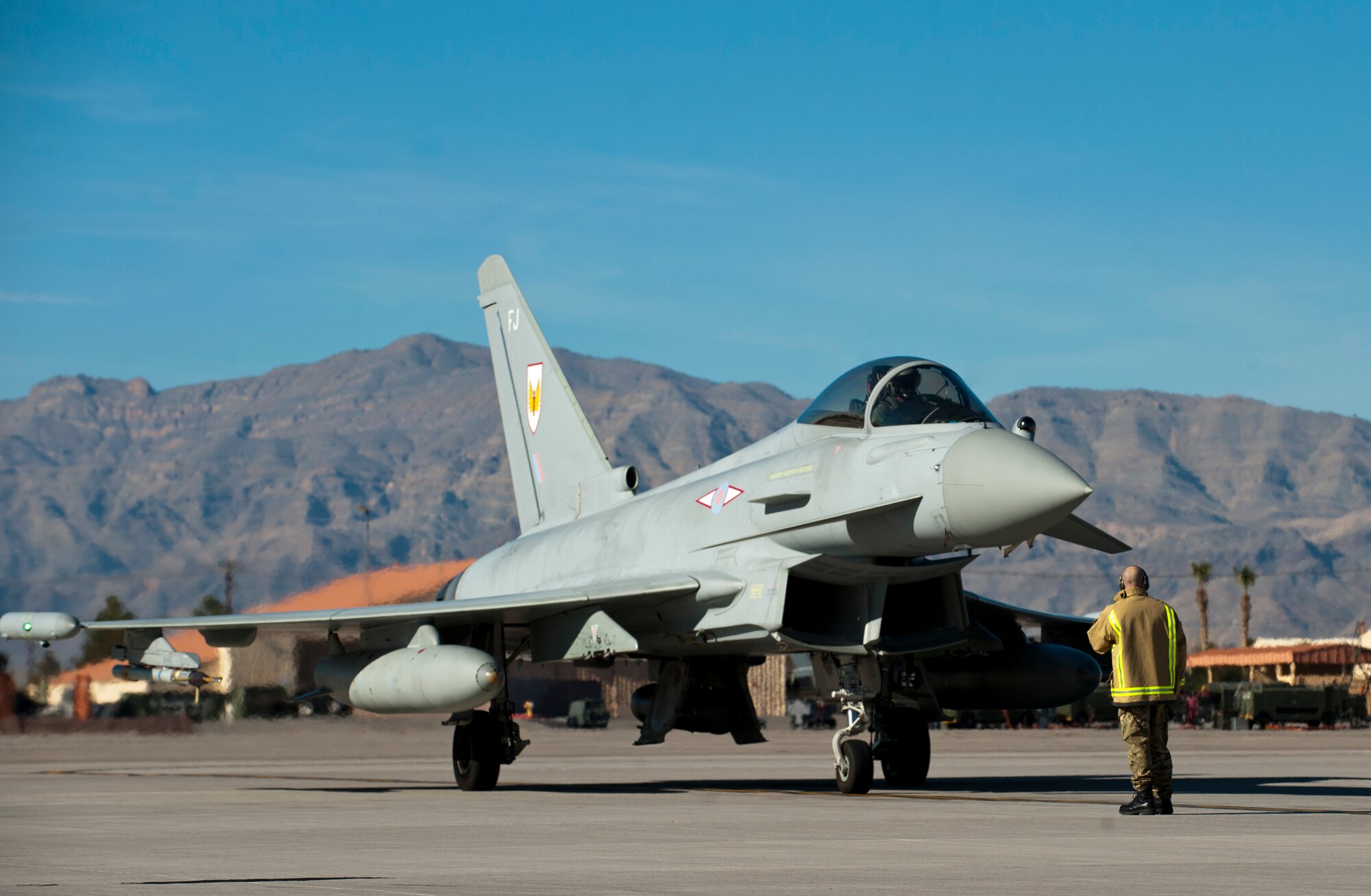 A Royal Air Force Typhoon FGR4 assigned to 1 (Fighter) Squadron, RAF Lossiemouth, Scotland, goes through final pre-flight checks before a training mission during Red Flag 15-1 at Nellis Air Force Base, Nev., Feb. 2, 2015. Red Flag is a realistic combat training exercise involving air, space and cyberforces of the U.S. and its allies. (U.S. Air Force photo by Senior Airman Thomas Spangler)
