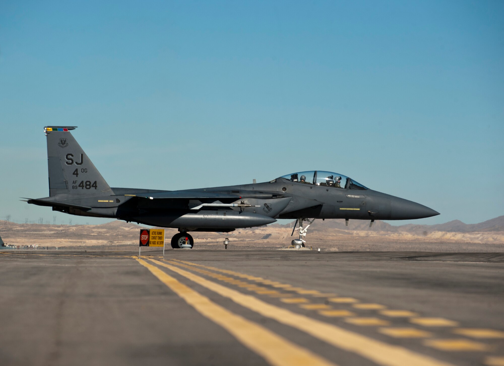 An F-15E Strike Eagle assigned to the 355th Fighter Squadron from Seymour Johnson Air Force Base, N.C., taxis to the runway during Red Flag 15-1 at Nellis AFB, Nev., Feb. 2, 2015. Red Flag provides a series of air-to-air combat scenarios which will increase aircrew and ground crew combat readiness and effectiveness. (U.S. Air Force photo by Senior Airman Thomas Spangler)
