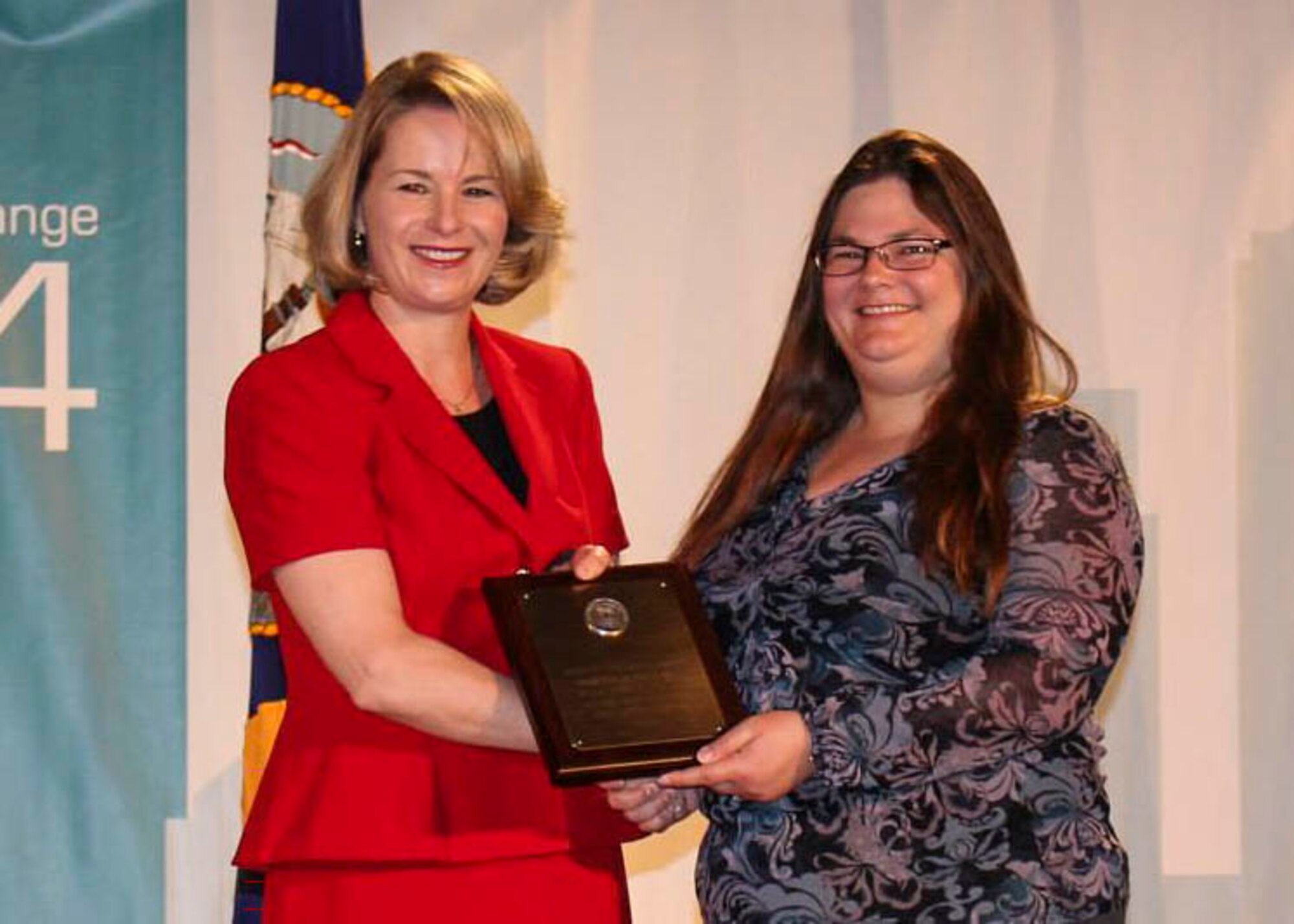 The national-level chapter leadership award was presented to Rebecca Pritchett (right) May 30, 2014, at the American Society of Military Comptrollers Professional Development Institute in Seattle, Washington. Pritchett was one of only two chapter leaders to receive the national award. (Courtesy photo)