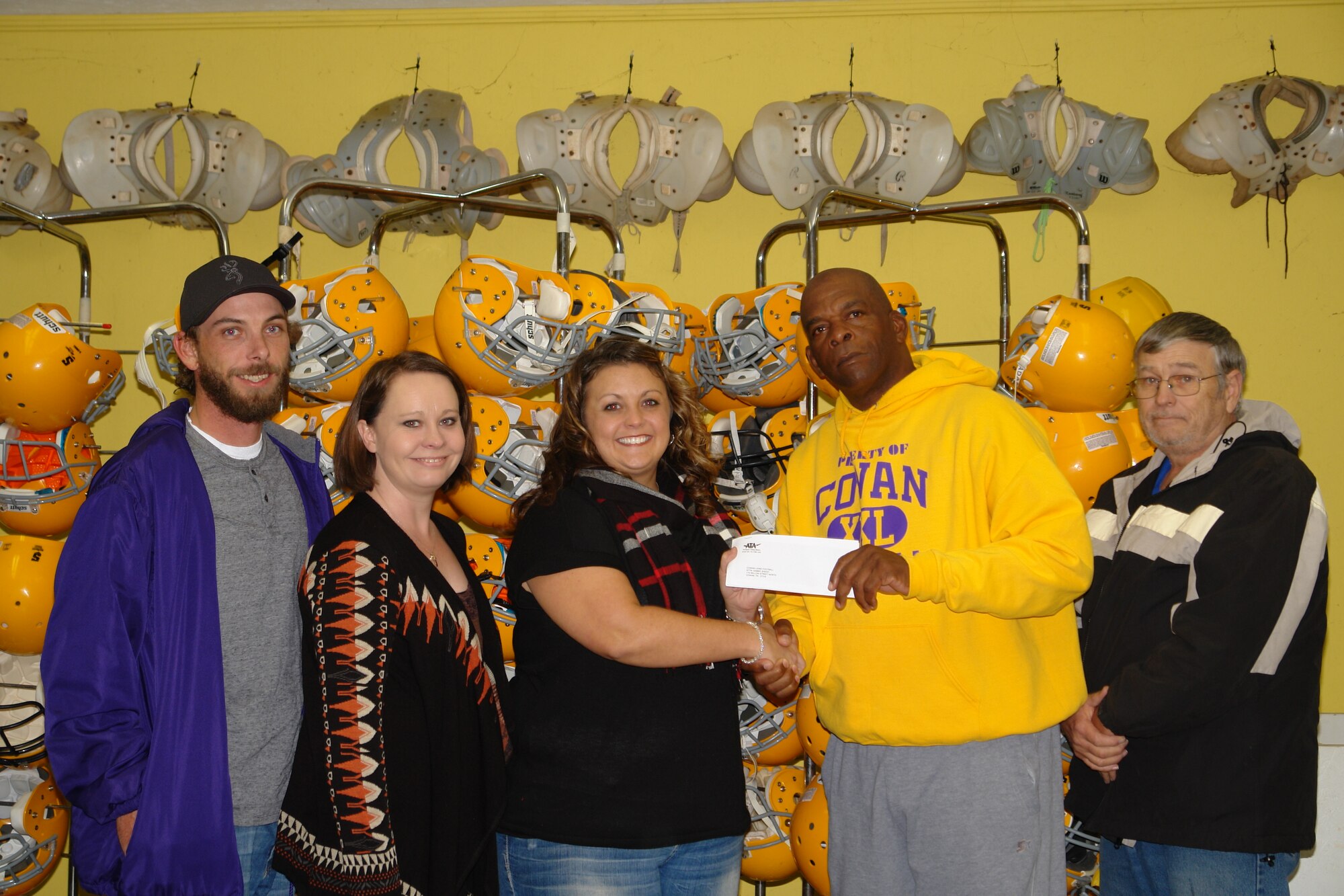 The Cowan Lions Football program receives a $150 donation for the team member’s safety equipment from the Aerospace Testing Alliance (ATA) Employee and Community Activities Committee (E&CAC). Pictured left to right are program volunteers Joshua and Amanda Kelly, E&CAC representative Andrea Stephens, Cowan Lions Football program President Sammy Shedd and the program treasurer Wayne Smith. (Photo by Kylee Stephens)