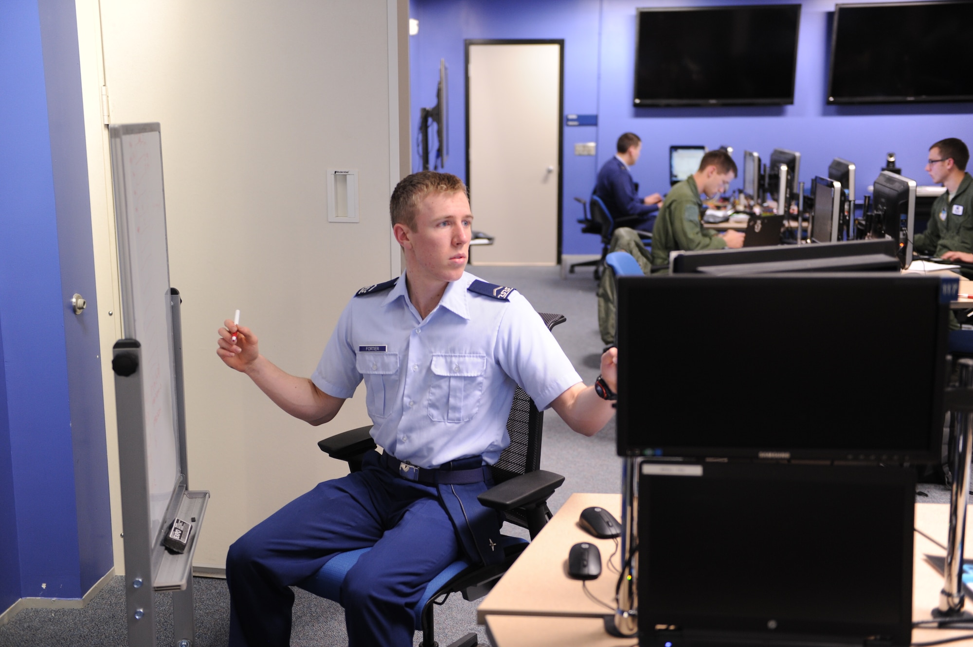 Cadet 3rd Class Kristopher Fortier works a problem-solving
exercise in the Air Force Academy's Cyber Warfare Laboratory in preparation
for an upcoming competition. Next up for the cadets is the Rocky Mountain
Collegiate Cyber Defense Competition, Feb. 27-28 at Regis University in the
Denver Tech Center.
