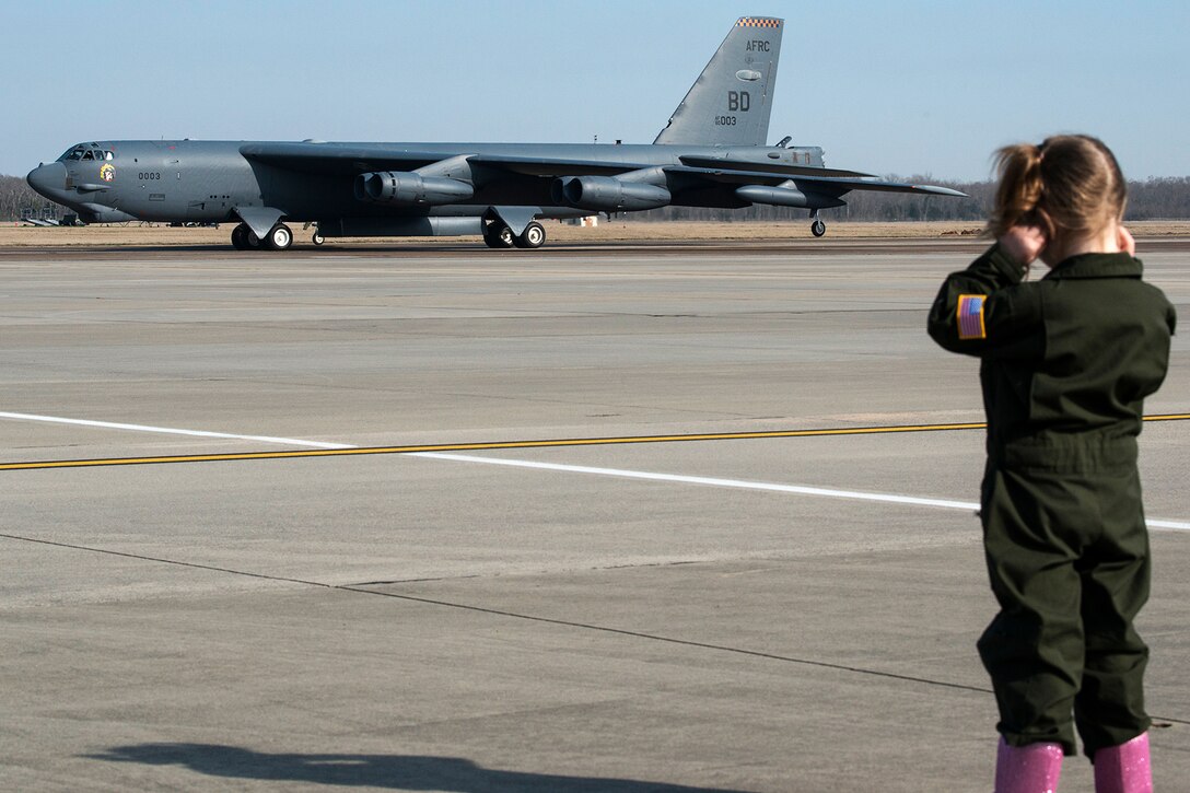 Katie Patchen waits as her dad, U.S. Air Force Lt. Col. Bryan Patchen, returns from a mission on Jan. 28, 2015, Barksdale Air Force Base, La. Patchen is an 11th Bomb Squadron B-52H Stratofortress instructor pilot and flew his last mission before retiring from the Air Force. (U.S. Air Force photo by Master Sgt. Greg Steele/Released)