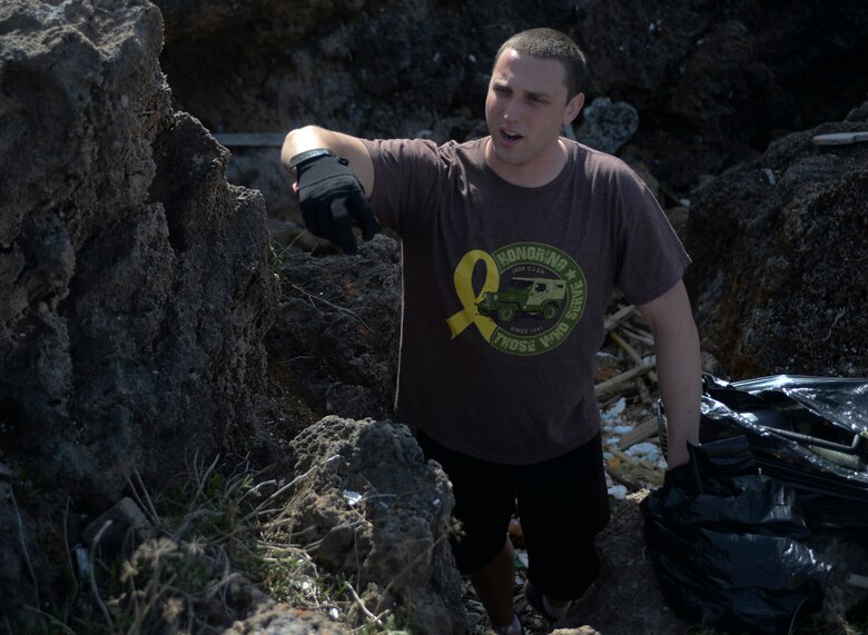 U.S. Air Force Senior Airman Tyler Marcee, a 52nd Expeditionary Logistics Readiness Squadron fuels journeyman, directs fellow Airmen during a beach cleanup at Chania, Greece, Jan. 31, 2015. Marcee organized the beach cleanup after seeing the trash along the shoreline during a previous trip there. (U.S. Air Force photo by Staff Sgt. Joe W. McFadden/Released) 