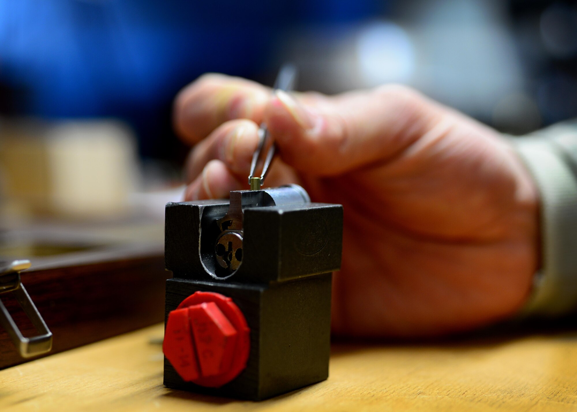 U.S. Air Force Staff Sgt. Christopher Carey, 31st Civil Engineer Squadron structural engineering craftsman, places pin segments into an interchangeable core for a keyhole, Feb. 2, 2015, at Aviano Air Base, Italy. To become a structural engineering locksmith, Airmen must complete a four-week certification course that allows them to maintain safes, vaults and other lock and key systems. (U.S. Air Force photo by Staff Sgt. Evelyn Chavez/Released)