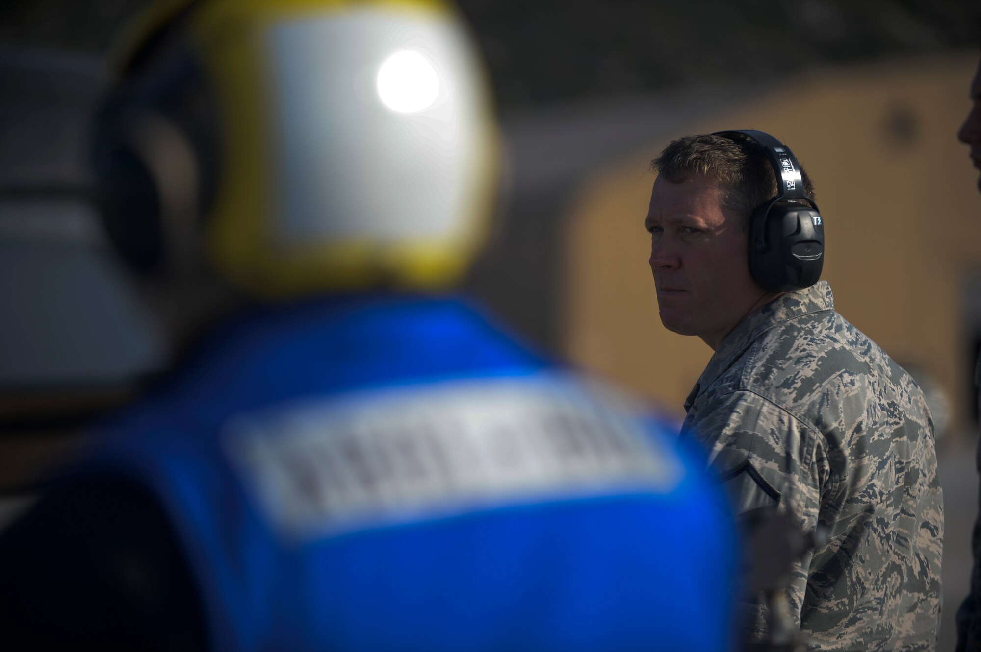 U.S. Air Force Master Sgt. Andrew Hogan, fuels manager assigned to the 52nd Expeditionary Logistics Readiness Squadron, observes an F-16 Fighting Falcon fighter aircraft being refueled on the flightline during a flying training deployment at Souda Bay, Greece, Jan. 30, 2015.  The hot pit refueling process involved pumping engine fuel into an aircraft as its engine still runs, enabling it to continue flying operations with minimum interruption. (U.S. Air Force photo by Staff Sgt. Joe W. McFadden/Released)