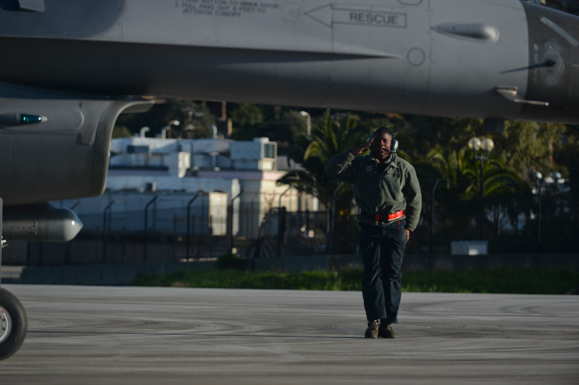 U.S. Air Force Airman 1st Class Kendrick Hargrove, a dedicated crew chief assigned to the 52nd Expeditionary Aircraft Maintenance Squadron, salutes as an F-16 Fighting Falcon fighter aircraft pilot assigned to the 480th Expeditionary Fighter Squadron taxis on the flightline during a flying training deployment at Souda Bay, Greece, Jan. 30, 2015. The aircraft conducted the training as part of the bilateral deployment between the Greek and U.S. Air Forces to develop interoperability and cohesion between the two NATO partners. (U.S. Air Force photo by Staff Sgt. Joe W. McFadden/Released)