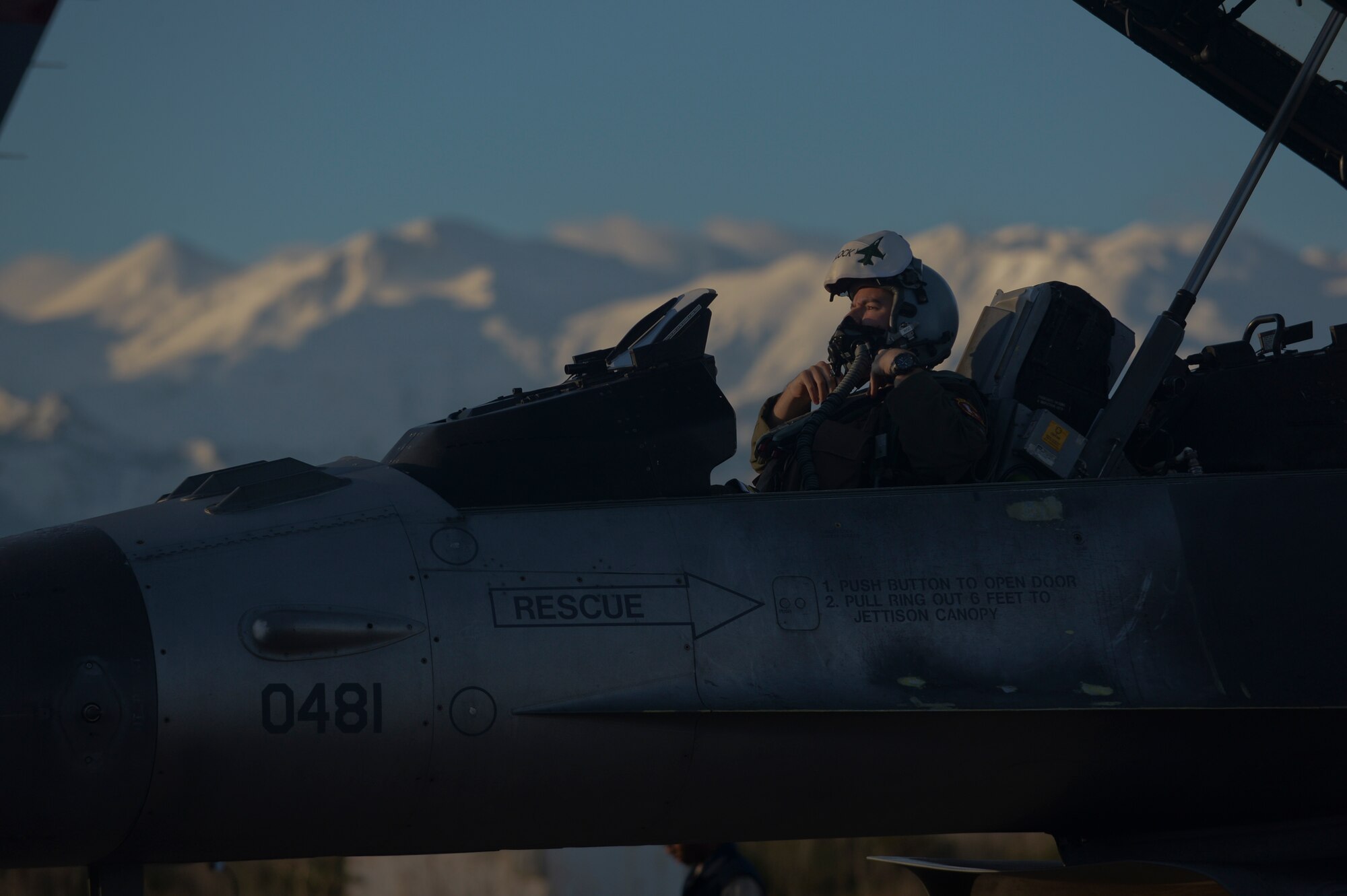 A U.S. Air Force F-16 Fighting Falcon fighter aircraft pilot assigned to the 480th Expeditionary Fighter Squadron fastens his breathing mask onto his helmet while in the aircraft's cockpit on the flightline during a flying training deployment at Souda Bay, Greece, Jan. 30, 2015. The aircraft conducted the training as part of the bilateral deployment between the Greek and U.S. Air Forces to develop interoperability and cohesion between the two NATO partners. (U.S. Air Force photo by Staff Sgt. Joe W. McFadden/Released)