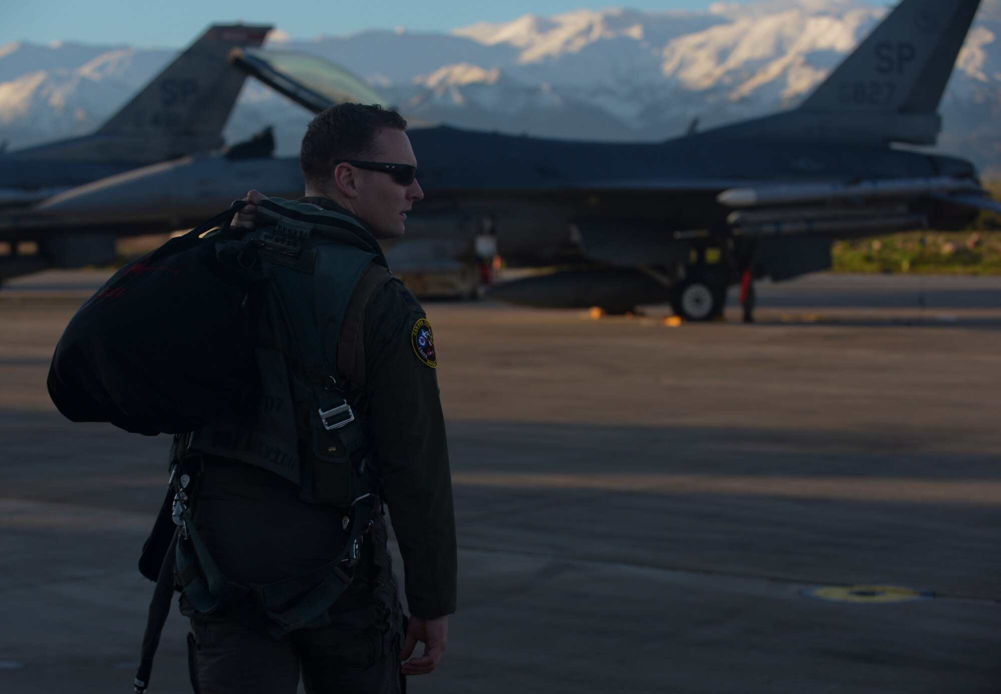 A U.S. Air Force F-16 Fighting Falcon fighter aircraft pilot assigned to the 480th Expeditionary Fighter Squadron heads to his aircraft on the flightline during a flying training deployment at Souda Bay, Greece, Jan. 30, 2015. The aircraft conducted the training as part of the bilateral deployment between the Greek and U.S. Air Forces to develop interoperability and cohesion between the two NATO partners. (U.S. Air Force photo by Staff Sgt. Joe W. McFadden/Released)