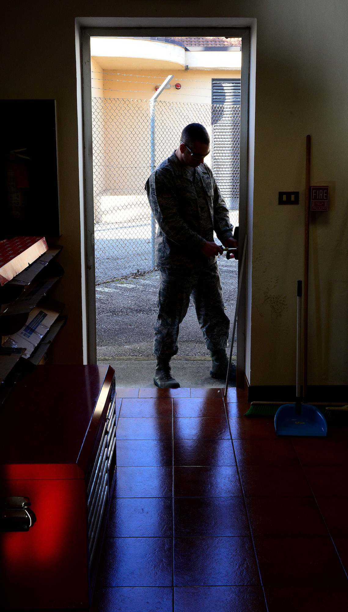 U.S. Air Force Staff Sgt. Christopher Carey, 31st Civil Engineer Squadron structural engineering, repairs a door lock, Feb. 2, 2015, at Aviano Air Base, Italy. Locksmith Airmen are the master key system for the base, maintaining hundreds of vaults and safes in support of the mission. (U.S. Air Force photo by Senior Airman Matthew Lotz/Released) 