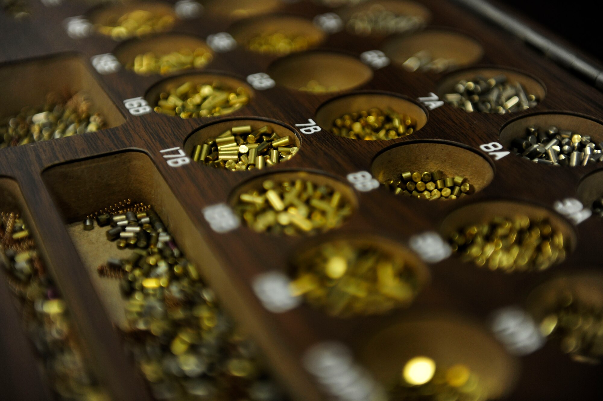 Pin segments for interchangeable keyhole cores are organized into a box, Feb. 2, 2015, at Aviano Air Base, Italy. Structural engineering Airmen with the 31st Civil Engineer Squadron are the master key system for the base, maintaining hundreds of vaults and safes in support of the mission. (U.S. Air Force photo by Staff Sgt. Evelyn Chavez/Released)