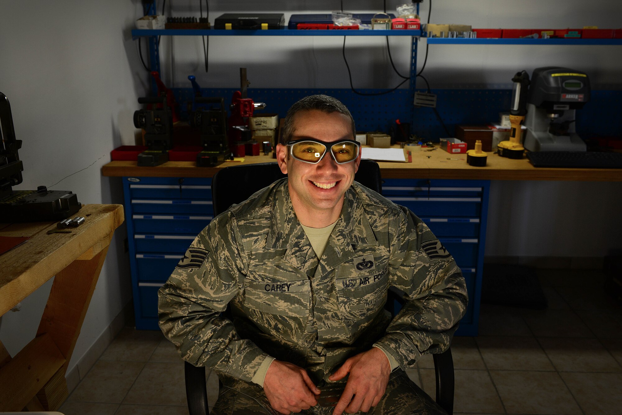 U.S. Air Force Staff Sgt. Christopher Carey, 31st Civil Engineer Squadron structural engineering craftsman, is responsible for repairing and producing keys and locks at Aviano Air Base, Italy. Locksmith Airmen are the master key system for the base, maintaining hundreds of vaults and safes in support of the mission. (U.S. Air Force photo by Senior Airman Matthew Lotz/Released)