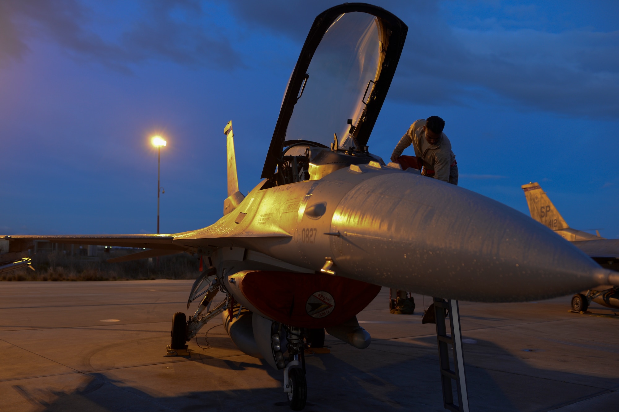U.S. Air Force Staff Sgt. Christopher Pridgen, a crew chief assigned to the 52nd Expeditionary Aircraft Maintenance Squadron, prepares an F-16 Fighting Falcon fighter aircraft assigned to the 480th Expeditionary Fighter Squadron for departure from the flightline during a flying training deployment at Souda Bay, Greece, Jan. 30. 2015. Pridgen, along with 300 personnel from Spangdahlem Air Base, Germany, participated in the flying training deployment between the Hellenic and U.S. Air Forces at Souda Bay, Jan. 16-Feb. 13, 2015. (U.S. Air Force photo by Staff Sgt. Joe W. McFadden/Released)