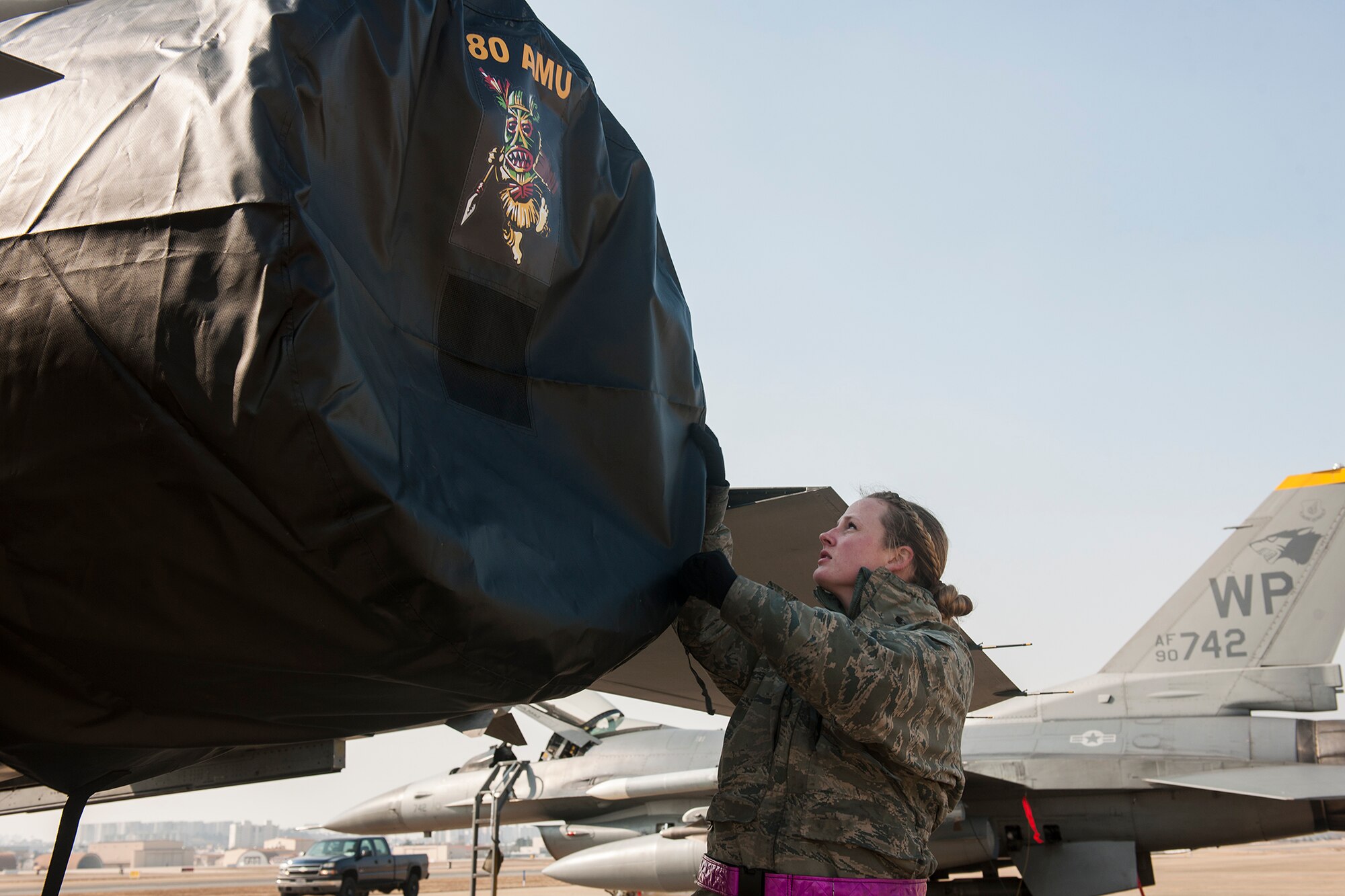 Senior Airman Randi Stroup, 8th Aircraft Maintenance Squadron crew chief, conducts a preflight inspection of an F-16 Fighting Falcon during Exercise Buddy Wing 15-2 at Daegu Air Base, Republic of Korea, Feb. 4, 2015. To meet the 7th Air Force operations tasking requirements for Buddy Wing 15-2, enlisted personnel from the 8th Fighter Wing deployed to Daegu to provide security, maintenance and operations support with their ROKAF counterparts. (U.S. Air Force photo by Senior Airman Katrina Heikkinen/Released)