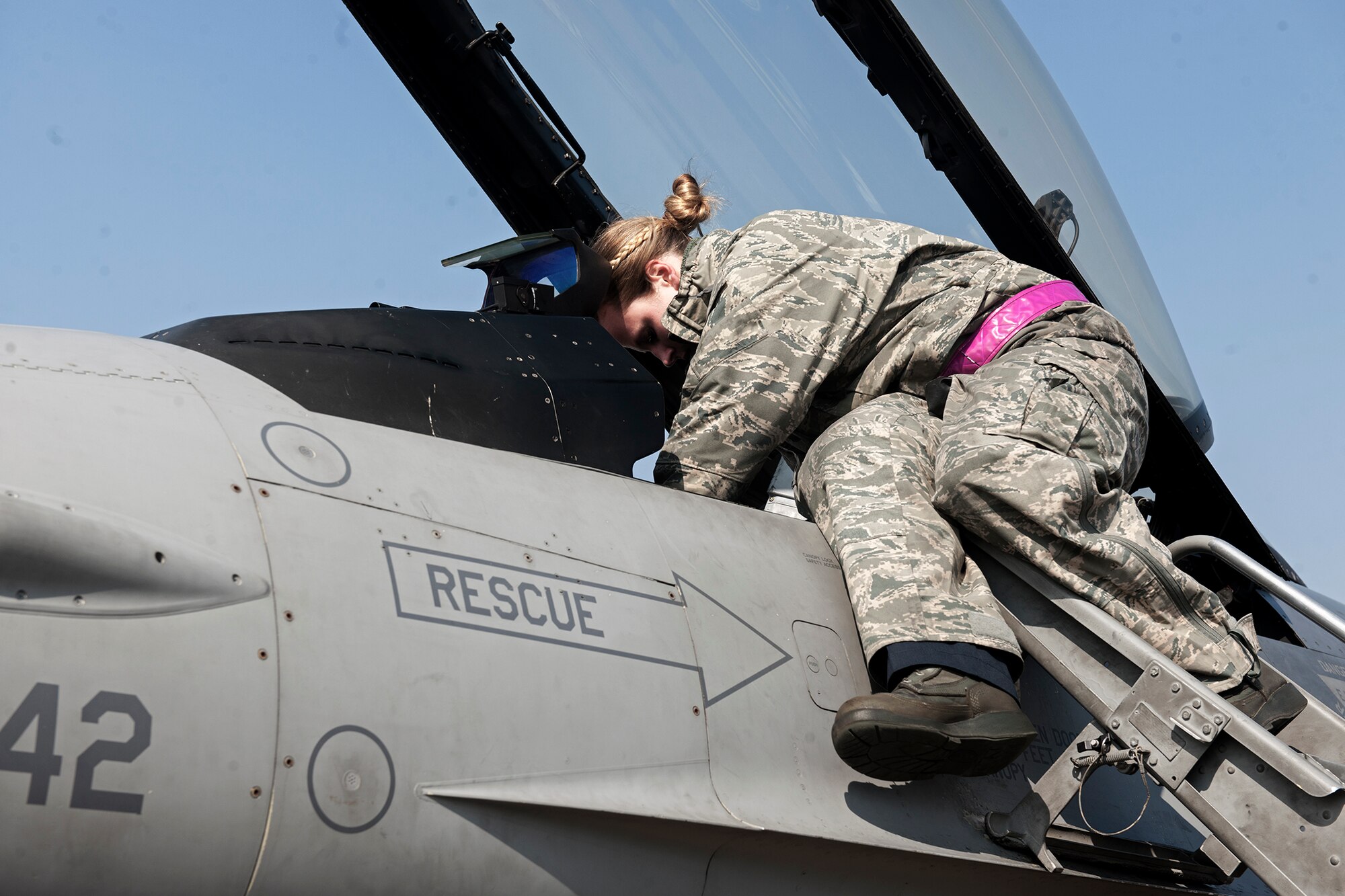 Senior Airman Randi Stroup, 8th Aircraft Maintenance Squadron crew chief, conducts a preflight inspection of an F-16 Fighting Falcon during Exercise Buddy Wing 15-2 at Daegu Air Base, Republic of Korea, Feb. 4, 2015. To meet the 7th Air Force operations tasking requirements for Buddy Wing 15-2, enlisted personnel from the 8th Fighter Wing deployed to Daegu to provide security, maintenance and operations support with their ROKAF counterparts. (U.S. Air Force photo by Senior Airman Katrina Heikkinen/Released)