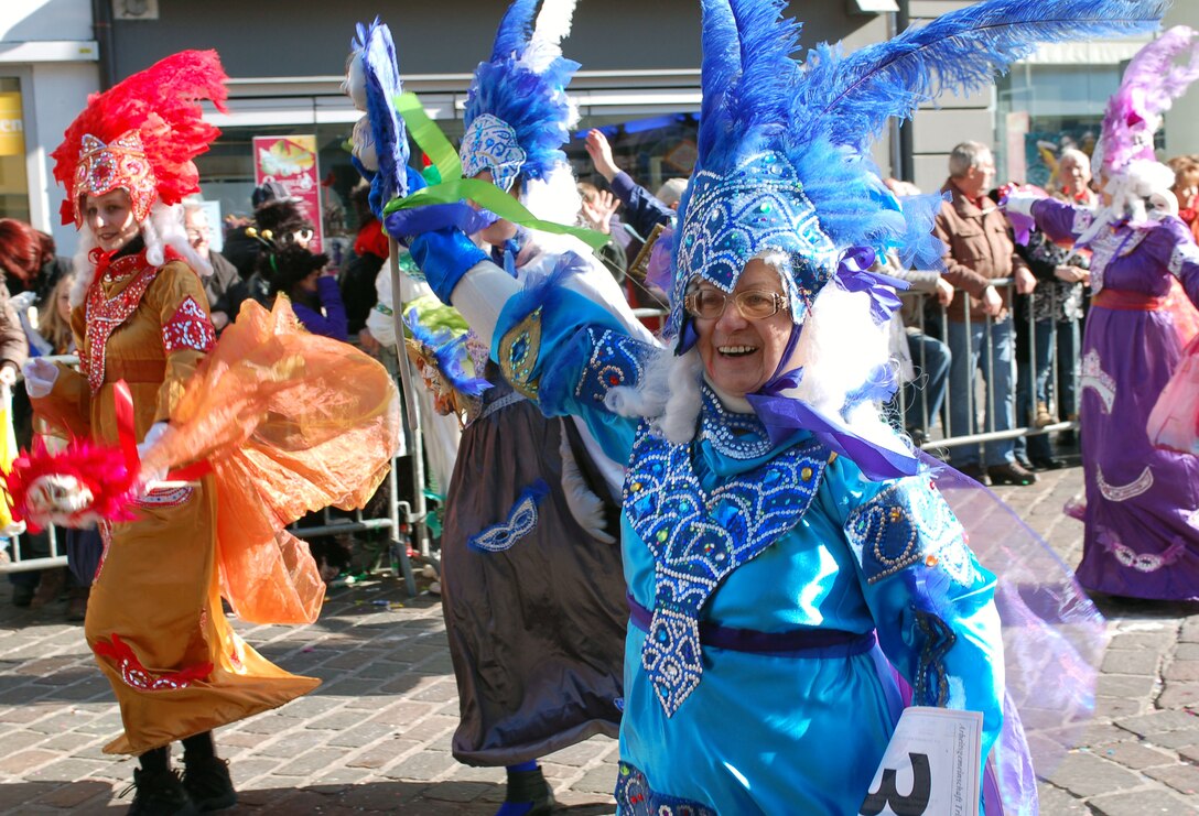 A group of women, dressed up in colorful Venetian costumes participate in a past Fasching parade in Trier, Germany. This year's parade is scheduled for 12:11 p.m., Feb. 16 through the streets of the city and ends at the Trier Arena hall with a large celebration. The event is several hours long, and it attracts people from near and far. Fasching activities in Germany start off on Ladies Fasching or Fat Thursday, Feb. 12, when the so called "Moehnen," or old ladies, wearing old women's face-masks traditionally storm local city halls. (U.S. Air Force photo by Iris Reiff/Released)