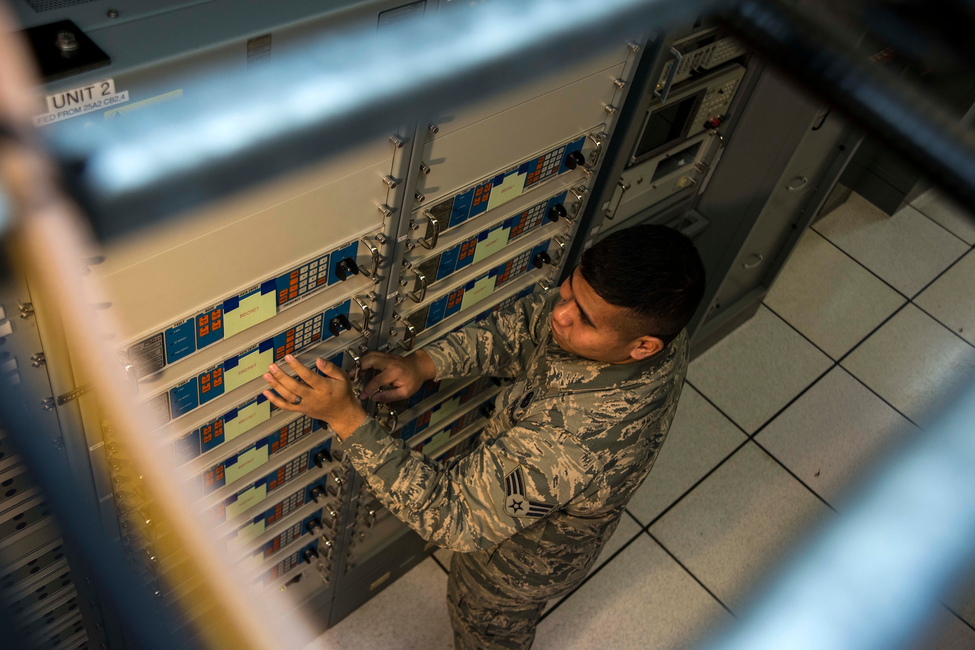 Senior Airman Philip Kengin, 35th Communications Squadron radio frequency transmission systems technician, performs a maintenance check on a timing system Jan. 31, 2015, at Misawa Air Base, Japan. Part of Kengin’s duties include maintaining the “Giant Voice,” also known as the Ultra Voice System, and ensuring it is tuned and calibrated so that any messages, alerts, or warnings can be sent out to the base. (U.S. Air Force photo by Staff Sgt. Derek VanHorn)