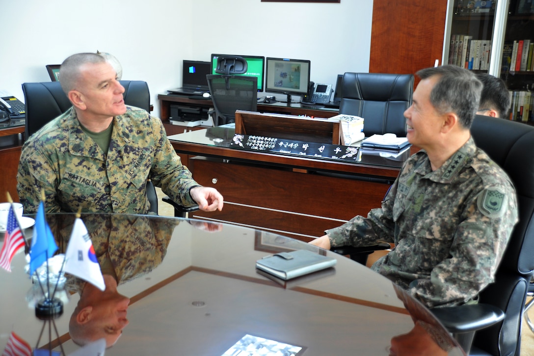 U.S. Marine Corps Sgt. Maj. Bryan Battaglia, left, senior enlisted ...