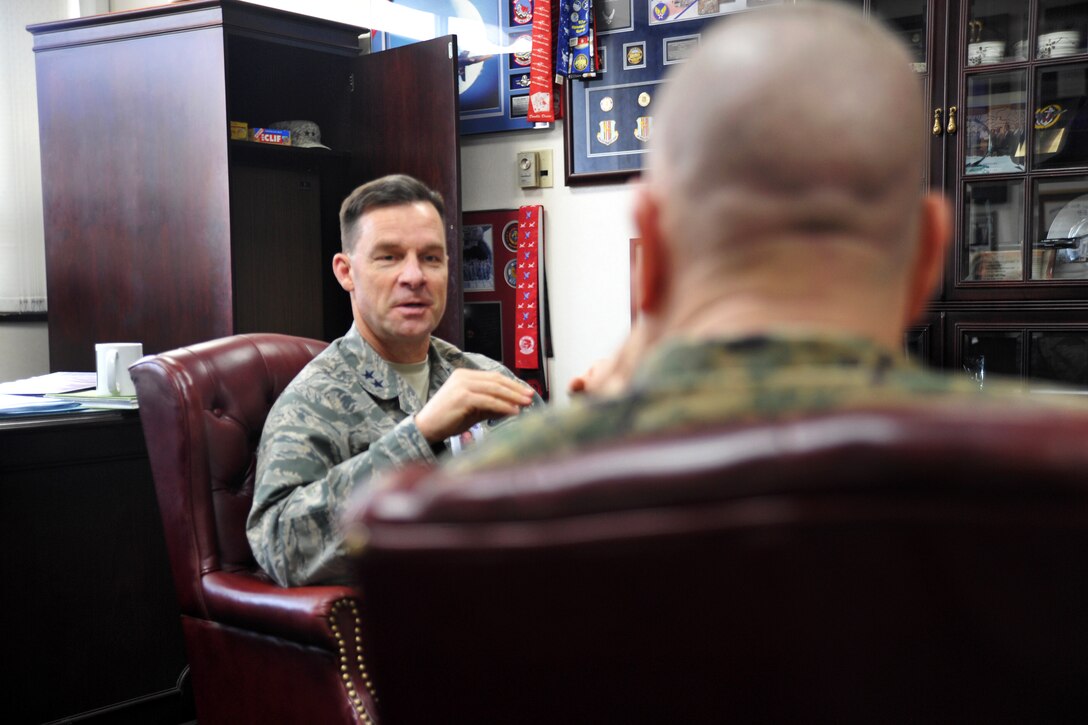 U.S. Air Force Maj. Gen. Mark Dillon, left, deputy chief of staff, U.S. Forces Korea, talks with U.S. Marine Corps Sgt. Maj. Bryan Battaglia, left, senior enlisted advisor to the chairman of the Joint Chiefs of Staff, during an office call on Yongsan Garrison in Seoul, South Korea, Feb. 3, 2015.
