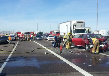 Army Staff Sgt. Brian Bowling and Pfc. LynnRae Acothley rendered aid at the scene of a five-vehicle collision on the east-bound Loop 202 in Tempe, Arizona, until first responders could arrive on scene Jan. 28, 2015. 