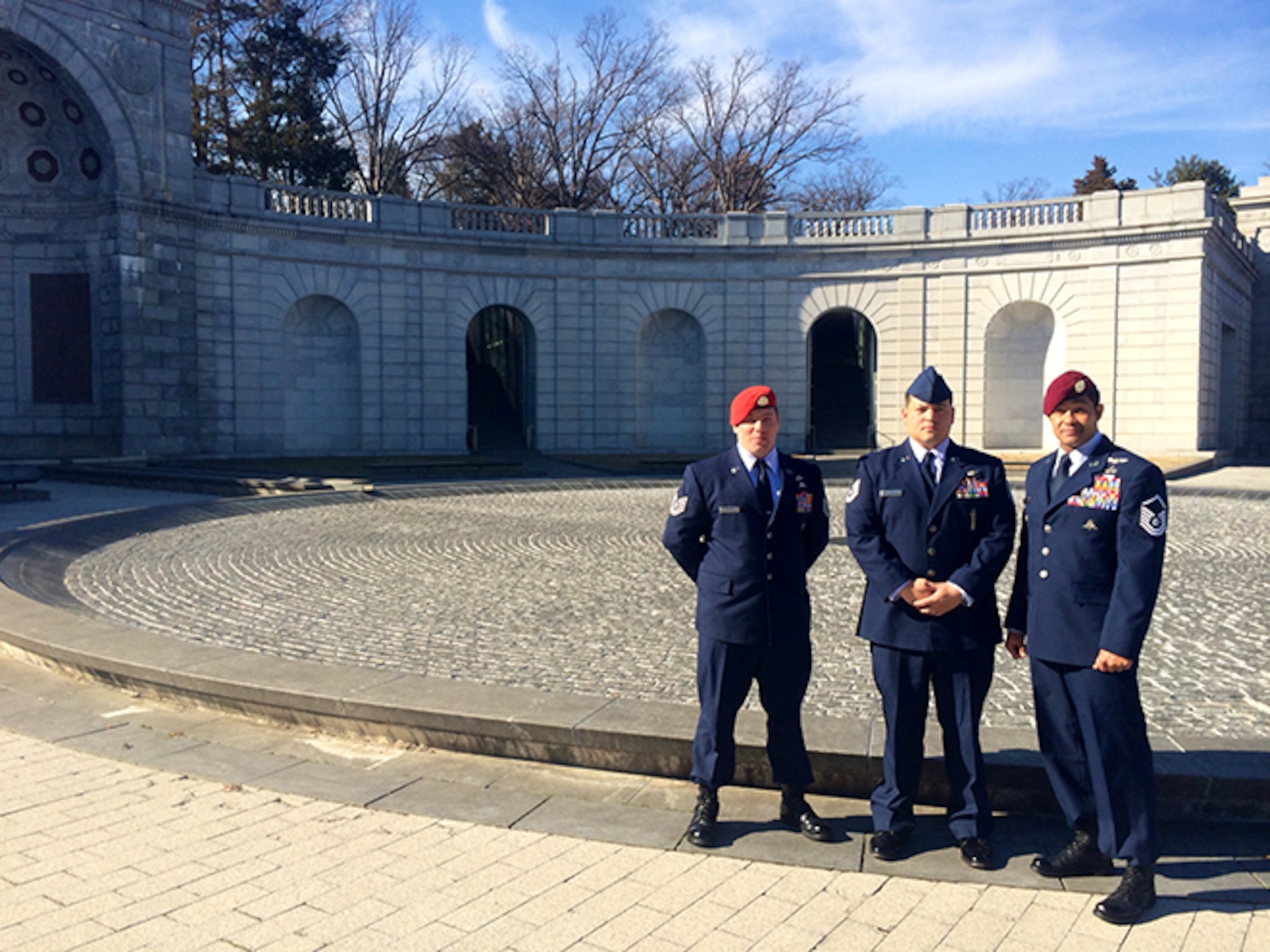 Three of the four Air Force Special Operations Airmen honored in this year's
Portrait in Courage pose in front of Arlington National Cemetery. Three
Special Tactics Airmen and a CV-22 Osprey special missions operator were
recognized for their acts of bravery above and beyond the call of duty. 
