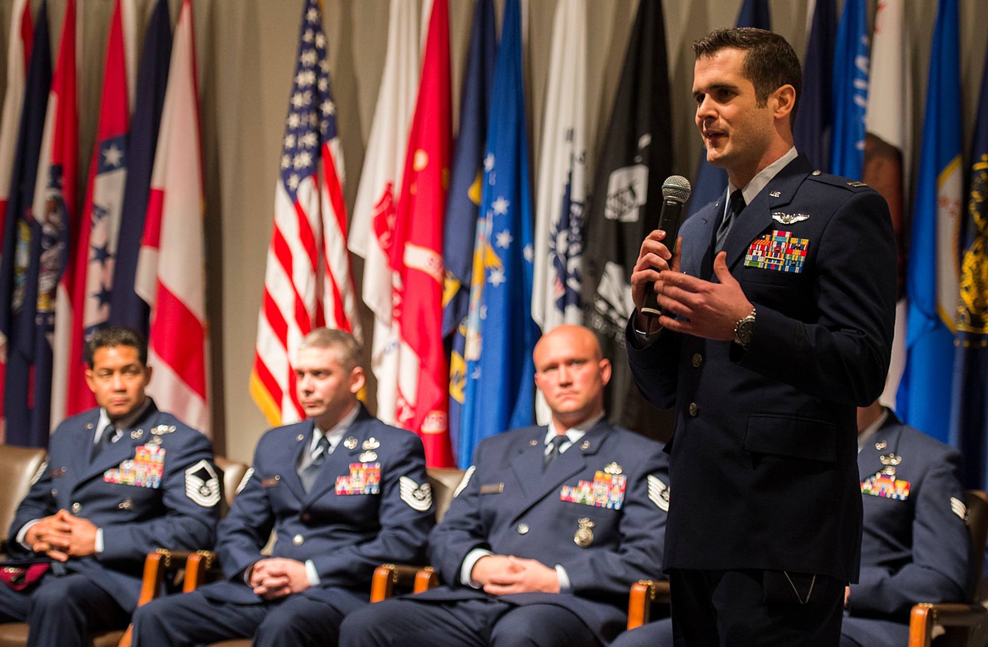 Air Force advisor Capt. Jeremy Powell, an honoree from the Air Force's ninth volume of Portraits in Courage, tells his story to a group of Air Force civic leaders from around the country, during a luncheon Feb. 4, 2015, Arlington, Va. Portraits in courage is an Air Force program highlighting Airmen for their honor, valor, devotion and selfless sacrifice in the face of extreme danger to themselves and others. (U.S. Air Force photo/Jim Varhegyi)
