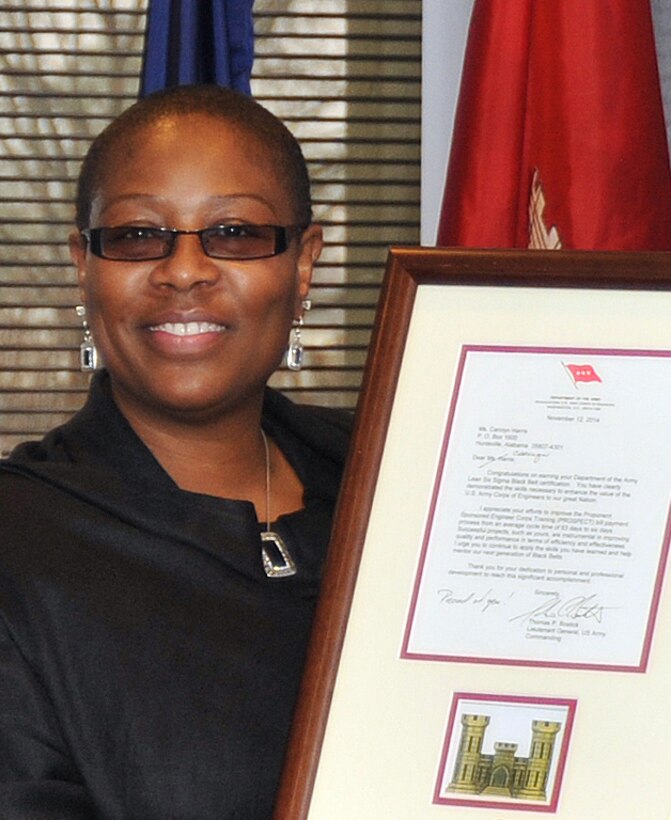 Carolyn Harris, Huntsville Center's Program Improvement Manager, holds the star note from U.S. Army Corps of Engineers Commanding General Lt. Gen. Thomas Bostick congratulating her on her Lean Six Sigma black belt project success.