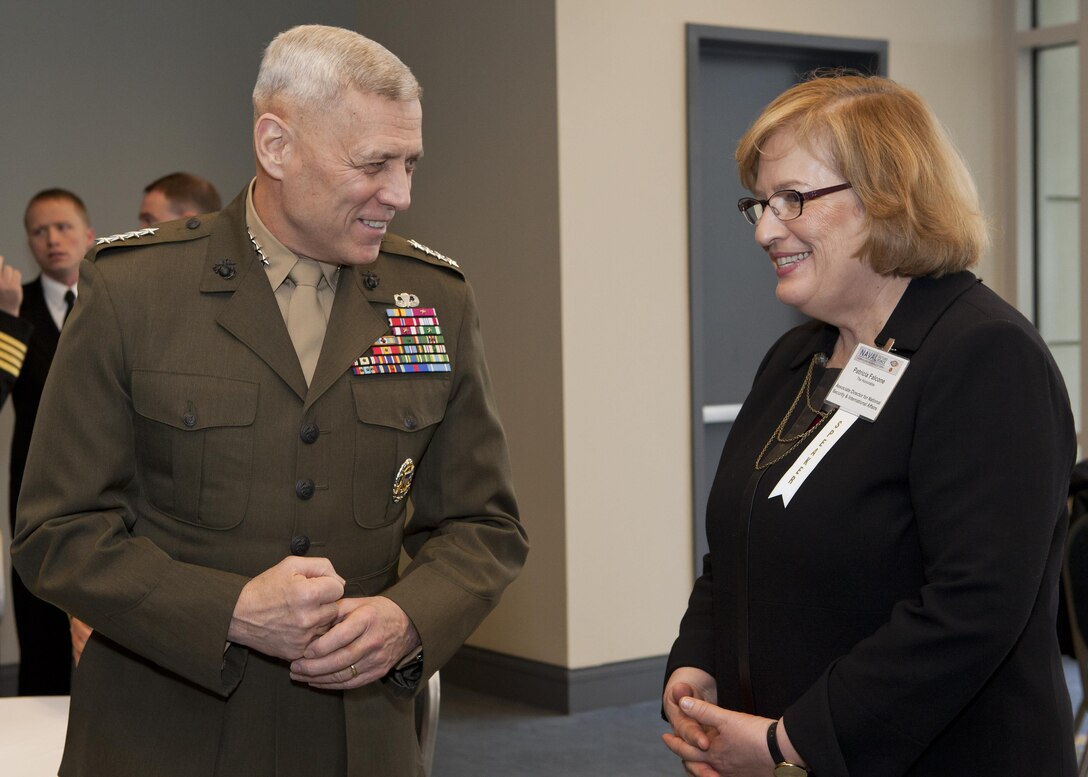 The Assistant Commandant of the Marine Corps, Gen. John M. Paxton, Jr., left, speaks with Patricia Falcone at the Naval Future Force Science and Technology Expo in Washington, D.C., Feb. 5, 2015. (U.S. Marine Corps photo by Cpl. Tia Dufour/Released)