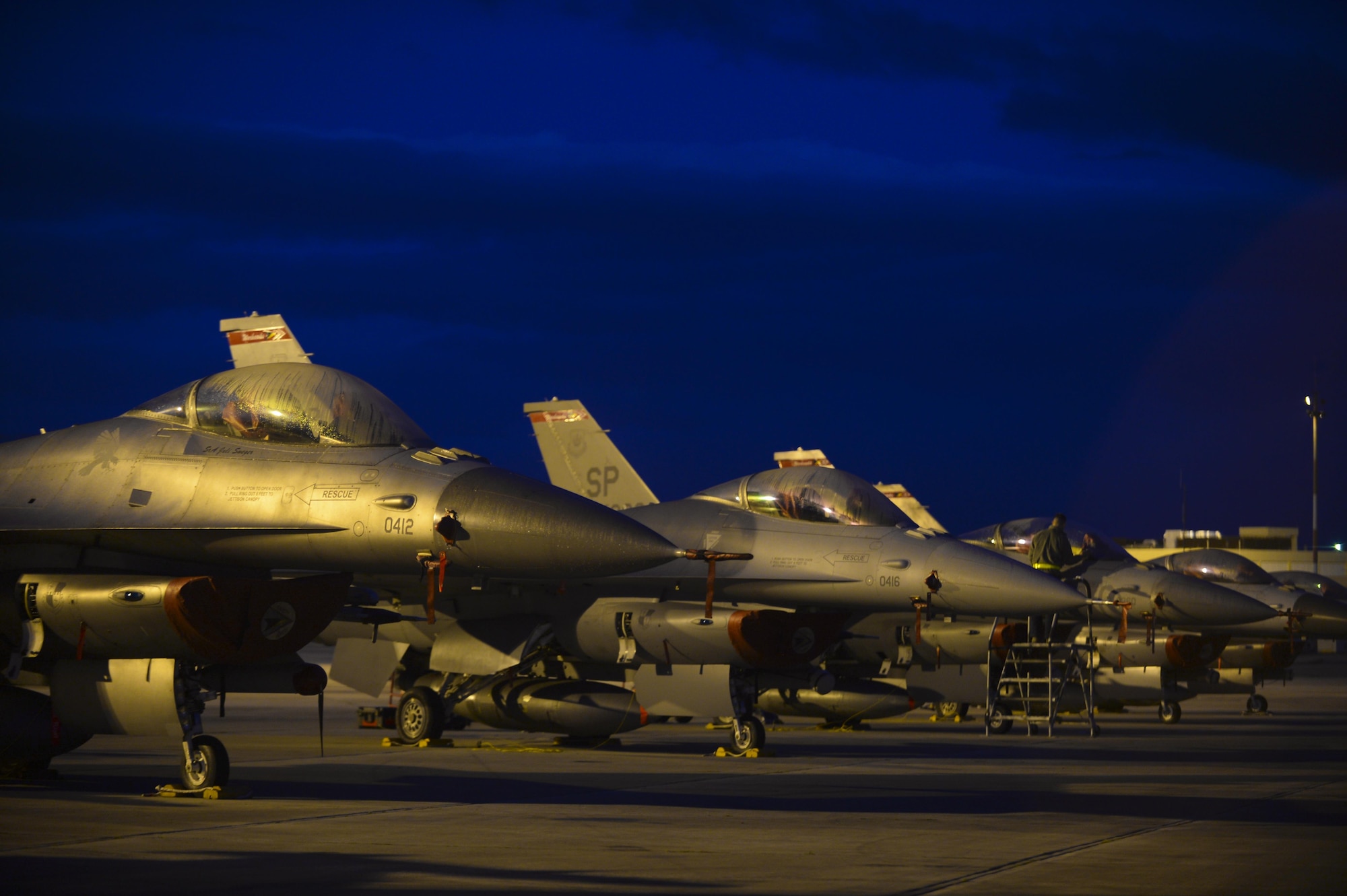 A row of U.S. Air Force F-16 Fighting Falcons remain parked on the flightline during a flying training deployment Jan. 30, 2015, at Souda Bay, Greece. The aircraft conducted the training as part of the bilateral deployment between the Hellenic and U.S. air forces to develop interoperability and cohesion between the two NATO partners. The F-16s are assigned to the 480th Expeditionary Fighter Squadron. (U.S. Air Force photo/Staff Sgt. Joe W. McFadden)
