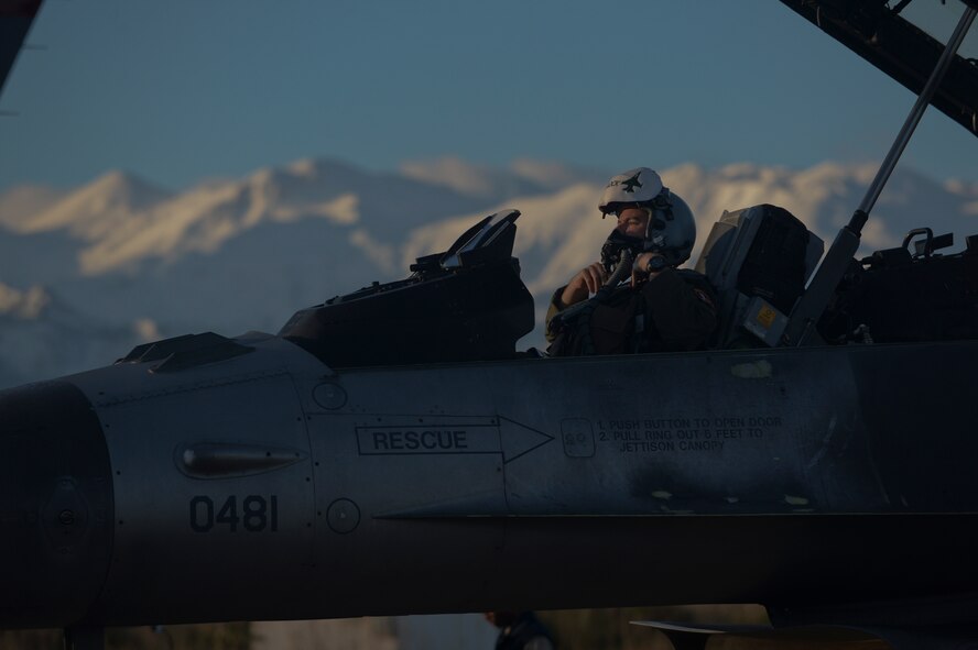 A U.S. Air Force F-16 Fighting Falcon pilot fastens his breathing mask onto his helmet during a flying training deployment Jan. 30, 2015, at Souda Bay, Greece. The aircraft conducted the training as part of the bilateral deployment between the Hellenic and U.S. air forces to develop interoperability and cohesion between the two NATO partners. The pilot is assigned to the 480th Expeditionary Fighter Squadron. (U.S. Air Force photo/Staff Sgt. Joe W. McFadden)