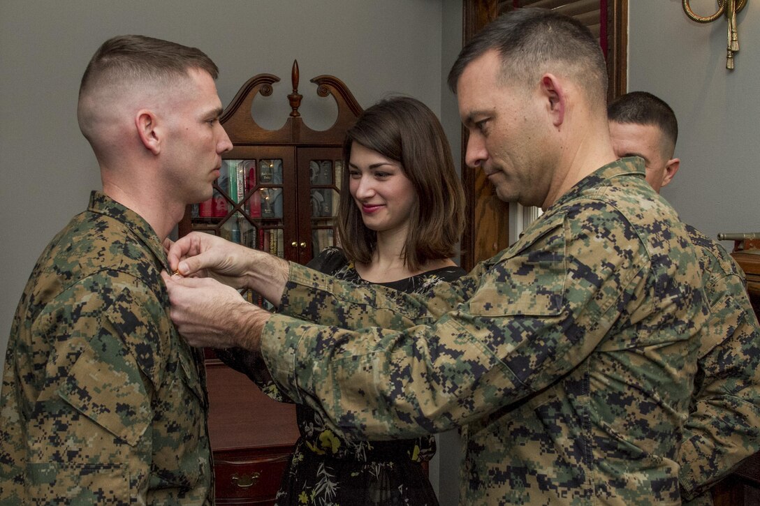 United States Marine Corps Staff Sgt. Nathan D. Morris becomes the newest Warrant Officer in the Marine Corps Drum and Bugle Corps during his promotion ceremony in Center House at Marine Barracks, Washington, D.C., on Feb. 5, 2015. (U.S. Marine Corps photo by Staff Sgt. Mallory S. VanderSchans/Released)