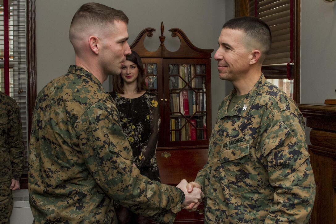 United States Marine Corps Col. Benjamin Watson, commanding officer, Marine Barracks, Washington, D.C., congratulates the newly promoted Warrant Officer Nathan D. Morris, in Center House, on Feb. 5, 2015. (U.S. Marine Corps photo by Staff Sgt. Mallory S. VanderSchans/Released)
