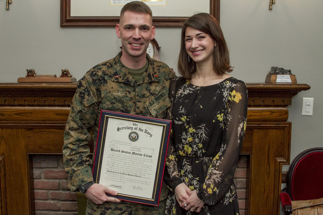 United States Marine Corps Warrant Officer Nathan D. Morris and his wife are all smiles during his promotion ceremony held in Center House at Marine Barracks, Washington, D.C., on Feb. 5, 2015. (U.S. Marine Corps photo by Staff Sgt. Mallory S. VanderSchans/Released)