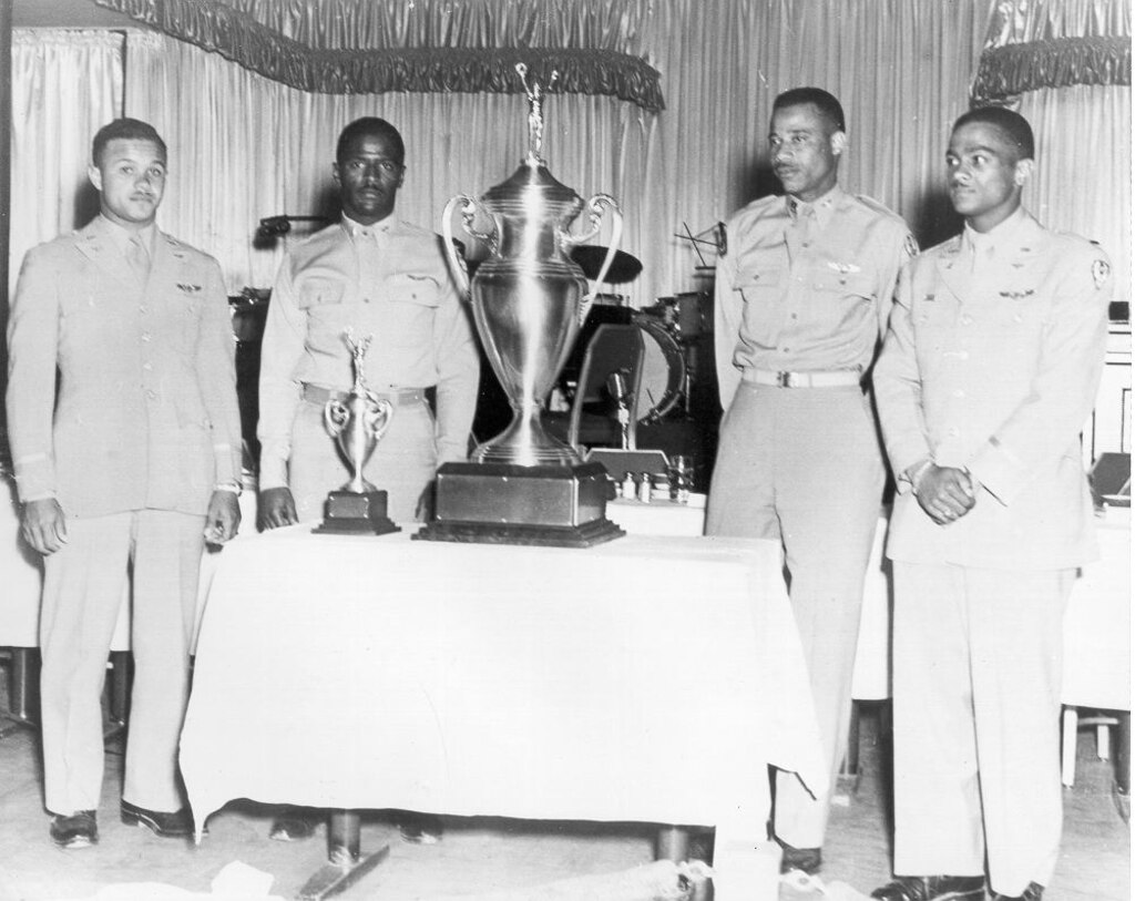 James H. Harvey III (second from left) with other Tuskegee Airmen who won the Air Force's inaugural weapons meet in 1949. That year, Harvey competed in the first USAF Weapons Meet at Las Vegas Air Force Base, Nev. As a first lieutenant, he, along with Capt. Alva Temple and 1st Lt. Harry Stewart, represented the 332nd Fighter Group Weapons Team where they won the competition flying their P-47N Thunderbolts. However, their victory wasn't officially recognized until April 1995. Harvey served more than 20 years in the military and would go on to become of a member of the famed Tuskegee Airmen and the first African-American pilot to fly combat missions over Korean airspace. 

