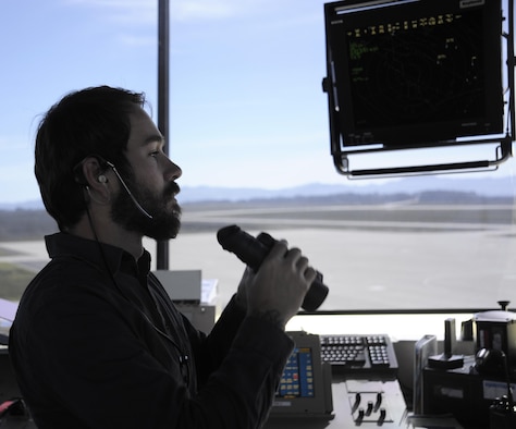 Robert Moore scans the runway for foreign objects from the control tower Feb. 2, 2015, at Vandenberg Air Force Base, Calif. Though not as busy as aircraft-centric bases, the Vandenberg AFB airfield serves as a central hub for the delivery of components for the base’s primary space mission. Moore is a 30th Operations Support Squadron air traffic control specialist. (U.S. Air Force photo/Airman 1st Class Ian Dudley)