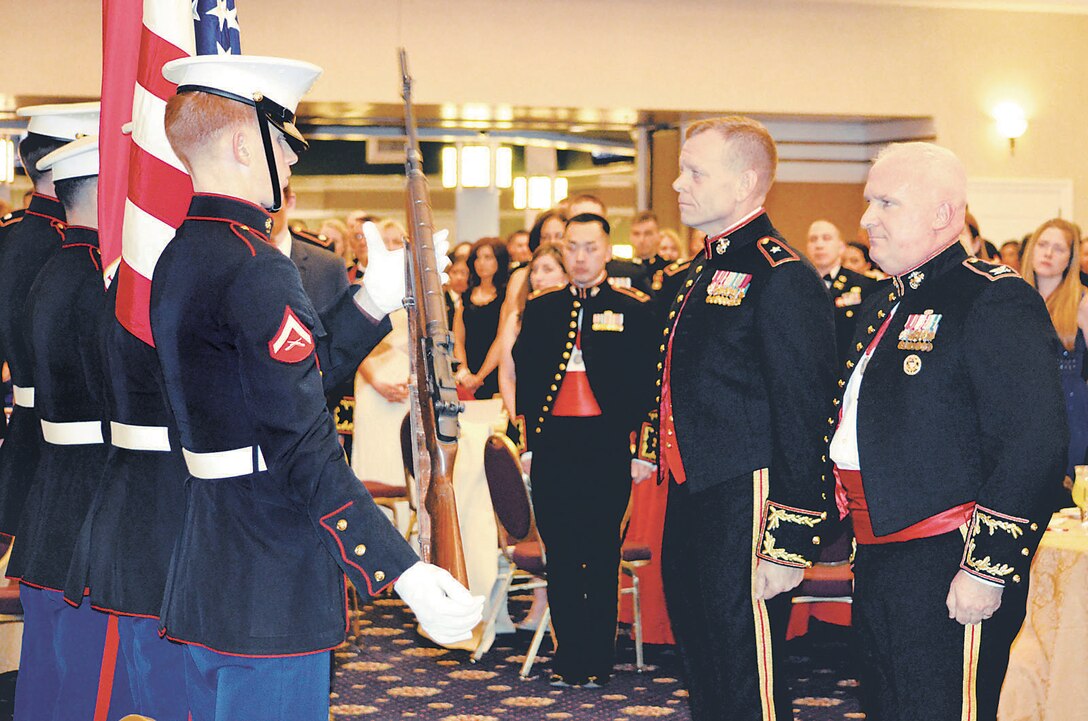 During the St. Barbara’s Day celebration at The Clubs at Quantico on Friday, guest of honor Brig. Gen. Joseph Shrader, commander of Marine Corps Systems Command, and Col. Timothy Parker, commanding officer of Weapons Training Battalion, receive the colors.
