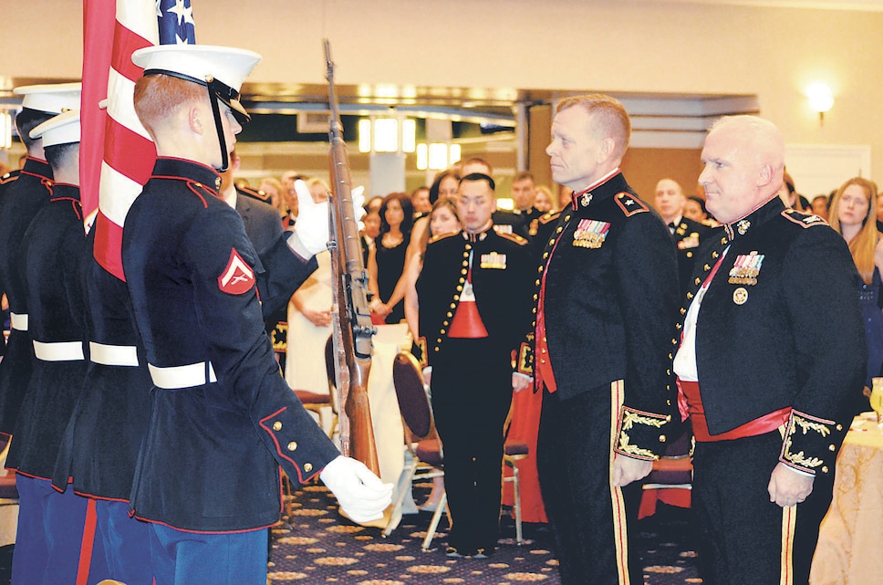 During the St. Barbara’s Day celebration at The Clubs at Quantico on Friday, guest of honor Brig. Gen. Joseph Shrader, commander of Marine Corps Systems Command, and Col. Timothy Parker, commanding officer of Weapons Training Battalion, receive the colors.