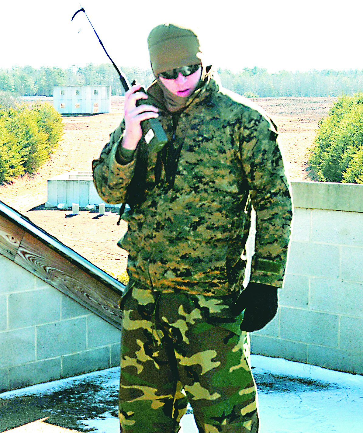 Sgt. Collin Rinderer, instructor, Marine Corps Intelligence School, speaks on the radio to one of the Marine Scout Sniper teams operating in the field Jan. 28 as part of the final exercise for the Scout Sniper Unit Leaders Course held on the Westside training area of Marine Corps Base Quantico.