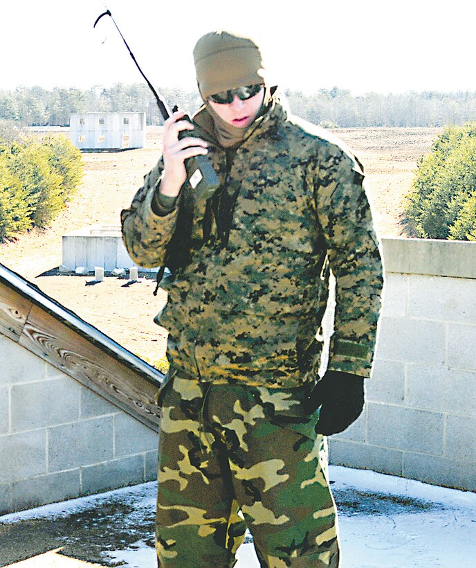 Sgt. Collin Rinderer, instructor, Marine Corps Intelligence School, speaks on the radio to one of the Marine Scout Sniper teams operating in the field Jan. 28 as part of the final exercise for the Scout Sniper Unit Leaders Course held on the Westside training area of Marine Corps Base Quantico.