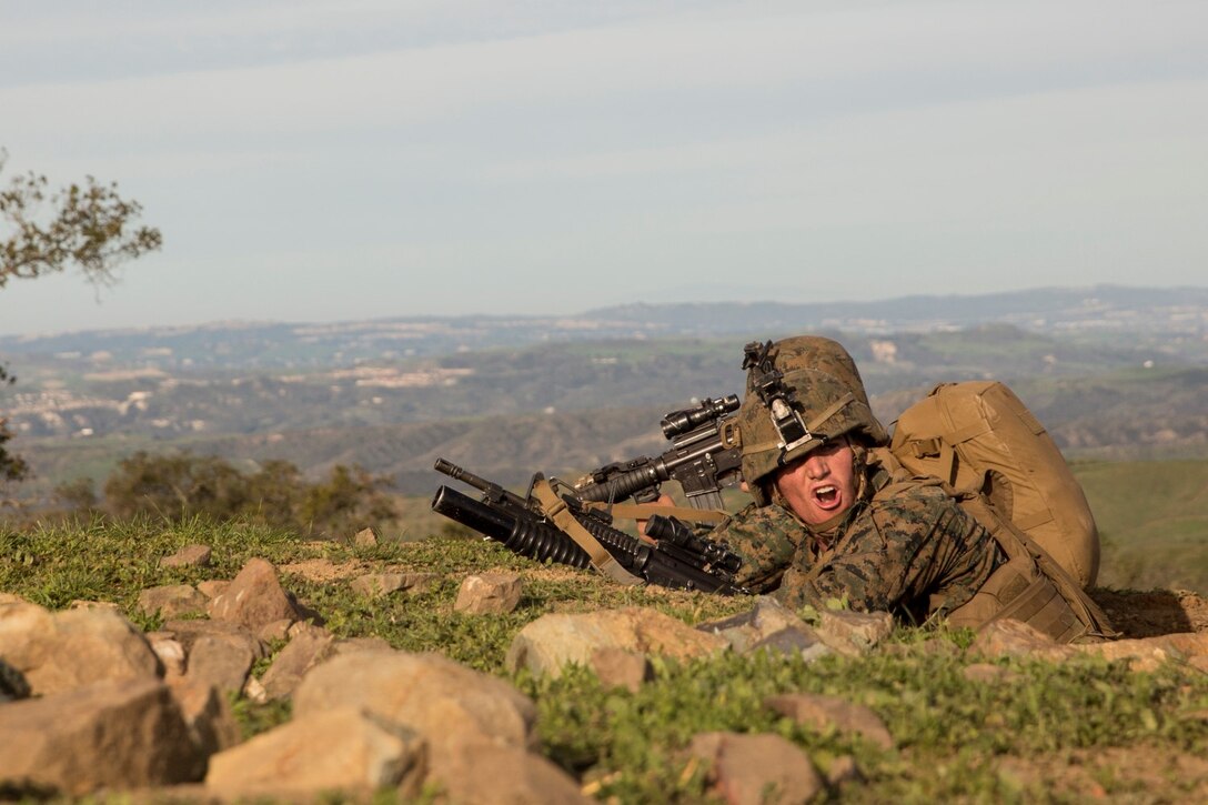 U.S. Marine Lance Cpl. Raul Fosselman gives directions during squad tactics and maneuver training aboard Camp Pendleton, Calif., Jan. 28, 2015. Fosselman is a team leader with Kilo Company, Battalion Landing Team 3rd Battalion, 1st Marine Regiment, 15th Marine Expeditionary Unit. As the ground combat element for the 15th MEU, BLT 3/1 is preparing for their upcoming deployment by enhancing their combat skills and learning to work as a cohesive unit. (U.S. Marine Corps Photo by Sgt. Emmanuel Ramos/Released)