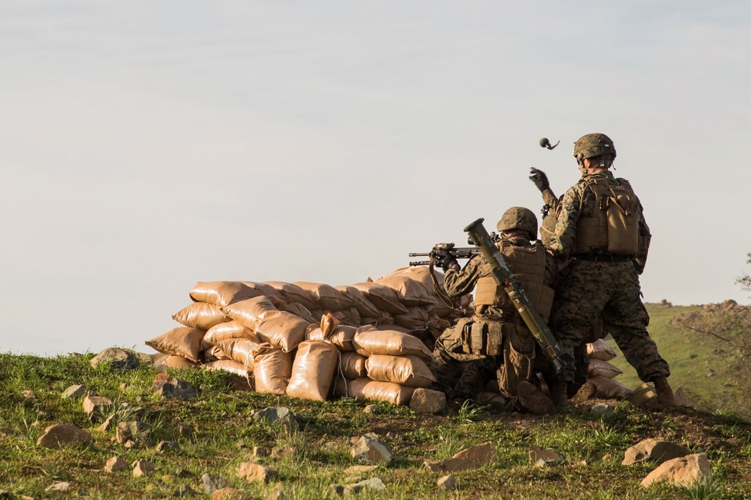 U.S. Marine Lance Cpl. Raul Fosselman throws an M67 grenade at a target during squad tactics and maneuver training aboard Camp Pendleton, Calif., Jan. 28, 2015. Fosselman is a team leader with Kilo Company, Battalion Landing Team 3rd Battalion, 1st Marine Regiment, 15th Marine Expeditionary Unit. As the ground combat element for the 15th MEU, BLT 3/1 is preparing for their upcoming deployment by enhancing their combat skills and learning to work as a cohesive unit. (U.S. Marine Corps Photo by Sgt. Emmanuel Ramos/Released)