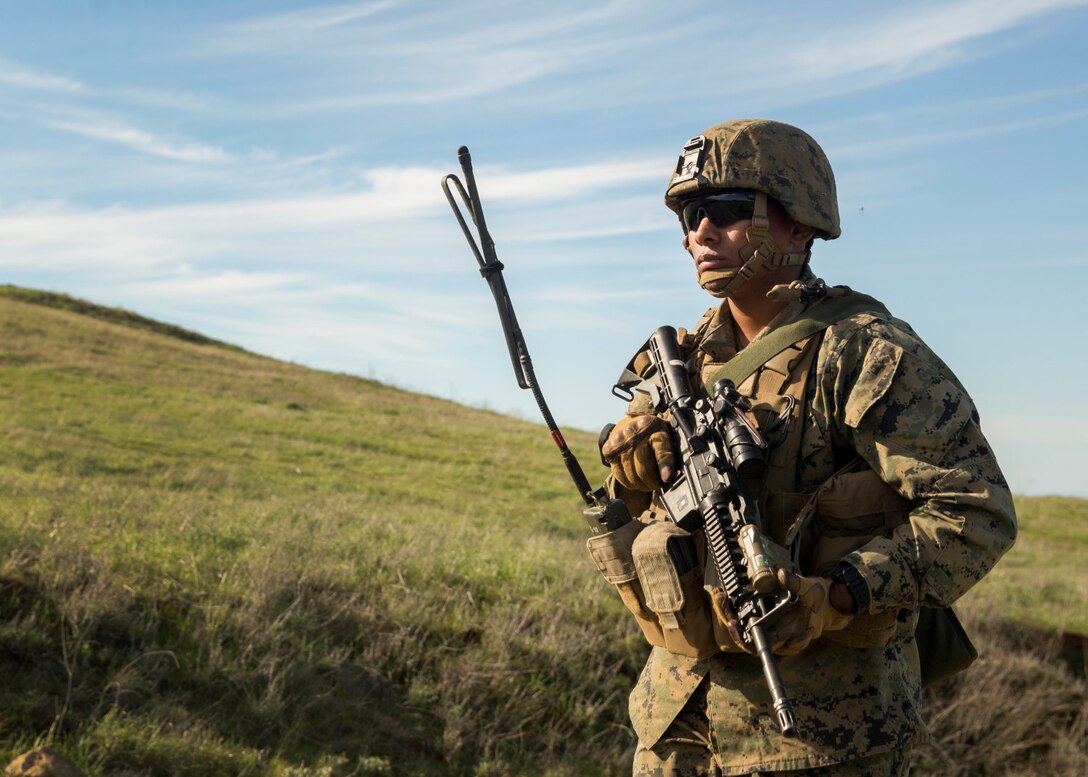 U.S. Marine Cpl. Jorge Castro patrols with his squad during squad tactics and maneuver training aboard Camp Pendleton, Calif., Jan. 27, 2015. Castro is a section leader with Kilo Company, Battalion Landing Team 3rd Battalion, 1st Marine Regiment, 15th Marine Expeditionary Unit. As the ground combat element for the 15th MEU, BLT 3/1 is preparing for their upcoming deployment by enhancing their combat skills and learning to work as a cohesive unit. (U.S. Marine Corps Photo by Sgt. Emmanuel Ramos/Released)