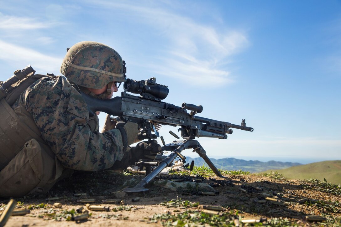 U.S. Marine Lance Cpl. Alexander Basco engages targets with his M240B machine gun during squad tactics and maneuver training aboard Camp Pendleton, Calif., Jan. 27, 2015. Bosco is a rifleman with Kilo Company, Battalion Landing Team 3rd Battalion, 1st Marine Regiment, 15th Marine Expeditionary Unit. As the ground combat element for the 15th MEU, BLT 3/1 is preparing for their upcoming deployment by enhancing their combat skills and learning to work as a cohesive unit. (U.S. Marine Corps Photo by Sgt. Emmanuel Ramos/Released)