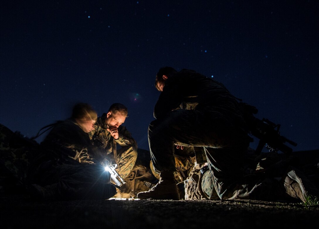 U.S. Marines with Kilo Company, Battalion Landing Team 3rd Battalion, 1st Marine Regiment, 15th Marine Expeditionary Unit, plan a mission during squad tactics and maneuver training aboard Camp Pendleton, Calif., Jan. 27, 2015. As the ground combat element for the 15th MEU, BLT 3/1 is preparing for their upcoming deployment by enhancing their combat skills and learning to work as a cohesive unit. (U.S. Marine Corps Photo by Sgt. Emmanuel Ramos/Released)