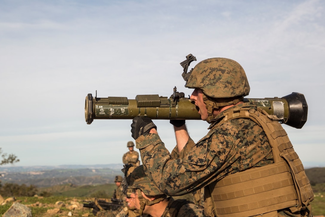 U.S. Marine Lance Cpl. Alex Hunt engages a target with an antitank missile trainer during squad tactics and maneuver training aboard Camp Pendleton, Calif., Jan. 28, 2015. Hunt is a rifleman with Kilo Company, Battalion Landing Team 3rd Battalion, 1st Marine Regiment, 15th Marine Expeditionary Unit. As the ground combat element for the 15th MEU, BLT 3/1 is preparing for their upcoming deployment by enhancing their combat skills and learning to work as a cohesive unit. (U.S. Marine Corps Photo by Sgt. Emmanuel Ramos/Released)