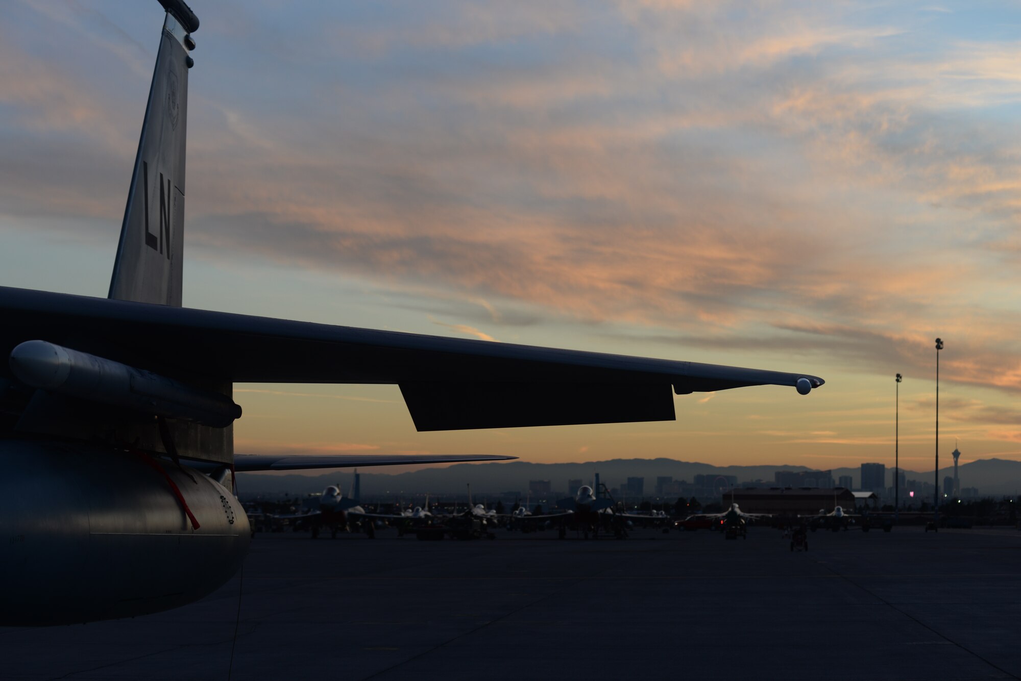 An F-15C Eagle assigned to the 493rd Fighter Squadron, Royal Air Force Lakenheath, England, sits on the flightline at dusk during Red Flag 15-1 at Nellis Air Force Base, Nev., Feb. 2, 2015. Flying units from around the world come to Nellis AFB to participate in Red Flag exercises, which are held three to four times per year. (U.S. Air Force photo by Tech. Sgt. Eric Burks/Released)
