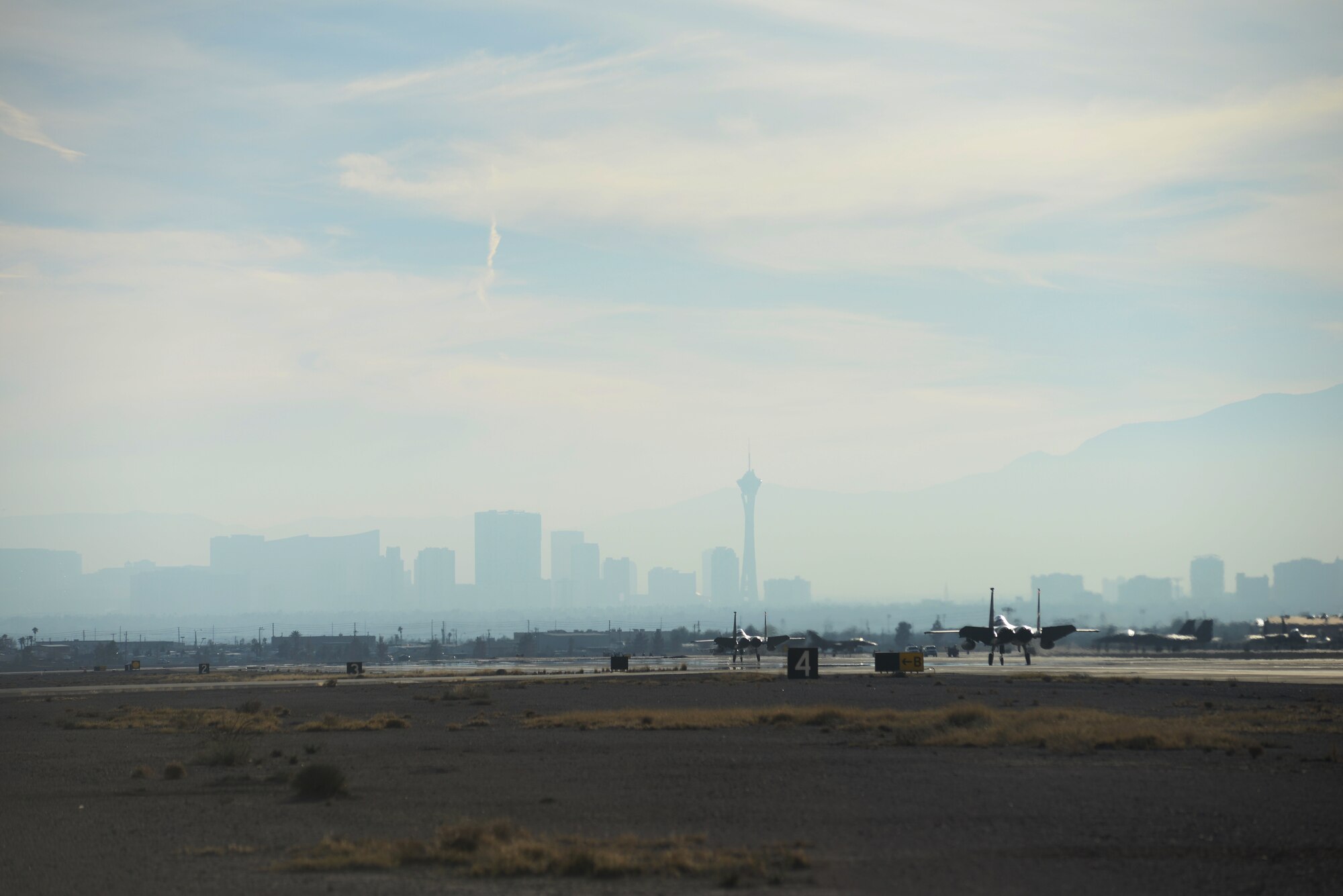 Two F-15C Eagles assigned to the 493rd Fighter Squadron, Royal Air Force Lakenheath, England, return from a sortie during Red Flag 15-1 at Nellis Air Force Base, Nev., Feb. 2, 2015. Red Flag is a realistic combat exercise involving U.S. and allied air forces conducting training operations on the 15,000 square mile Nevada Test and Training Range. (U.S. Air Force photo by Tech. Sgt. Eric Burks/Released)