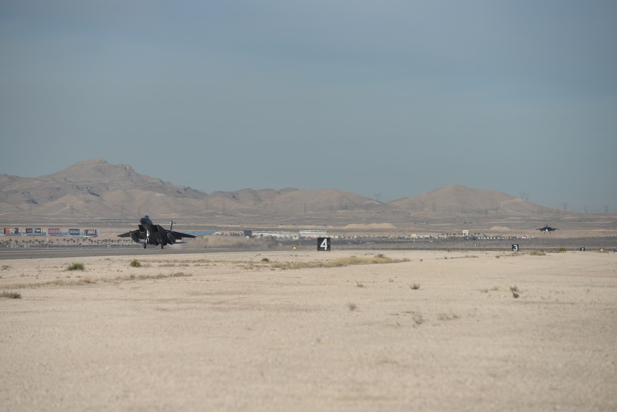 Two F-15C Eagles assigned to the 493rd Fighter Squadron, Royal Air Force Lakenheath, England, return from a sortie during Red Flag 15-1 at Nellis Air Force Base, Nev., Feb. 2, 2015. Red Flag is a realistic combat exercise involving U.S. and allied air forces conducting training operations on the 15,000 square mile Nevada Test and Training Range. (U.S. Air Force photo by Tech. Sgt. Eric Burks/Released)
