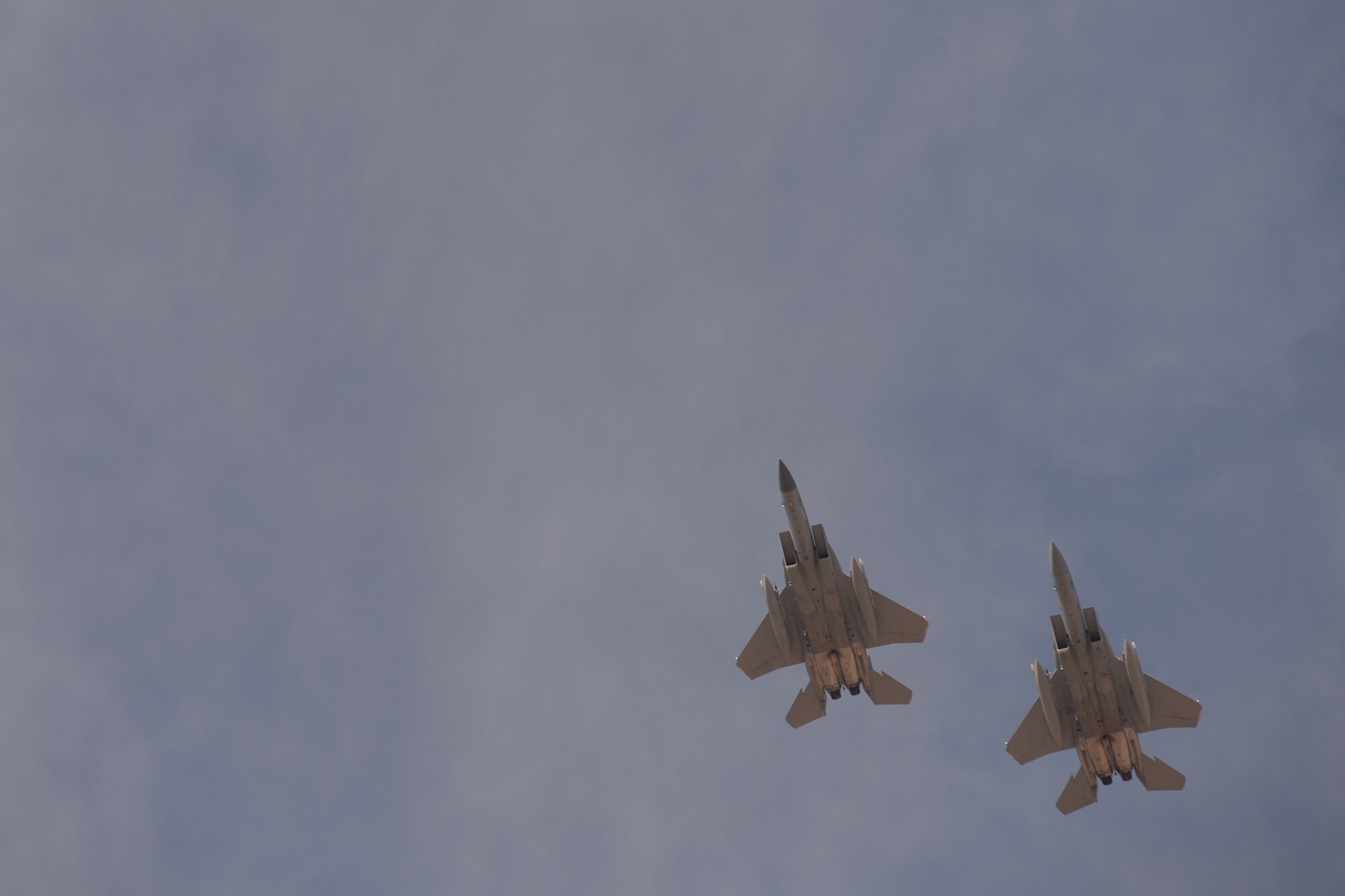 Two F-15C Eagles assigned to the 493rd Fighter Squadron, Royal Air Force Lakenheath, England, return from a sortie during Red Flag 15-1 at Nellis Air Force Base, Nev., Feb. 2, 2015. Red Flag is a realistic combat exercise involving U.S. and allied air forces conducting training operations on the 15,000 square mile Nevada Test and Training Range. (U.S. Air Force photo by Tech. Sgt. Eric Burks/Released)