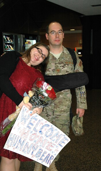 At the Seattle-Tacoma Airport Feb. 5, Theresa Byrd welcomes home her husband, Tech. Sgt. David Byrd, 36th Aerial Port Squadron, Joint Base Lewis-McChord, Washington. Byrd was among eight Reservist who returned Feb. 5 from a deployment to Senegal in support of Operation United Assistance. (U.S. Air Force Reserve photo by Sandra Pishner)