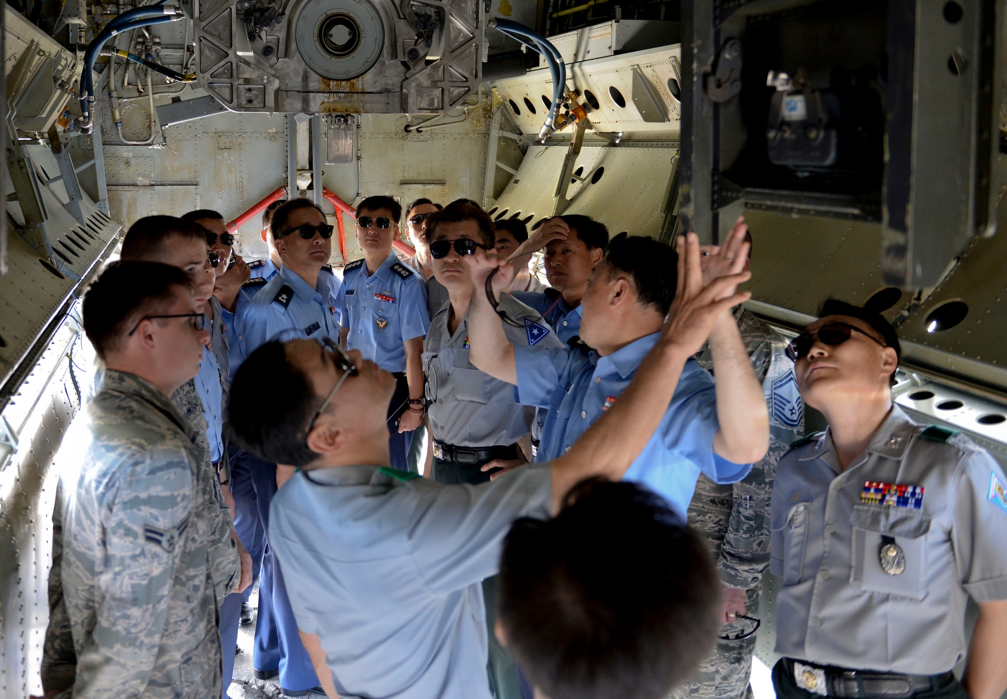 A group of Republic of Korea generals and admirals observe a B-52 Stratofortress bomb bay Jan. 30, 2015, at Andersen Air Force Base, Guam, as part of a Korea National Defense University capstone event. The course, which is designed for newly appointed flag officers, educates participants on key issues and capabilities of allied nations in the Pacific. (U.S. Air Force photo by Staff Sgt. Robert Hicks/Released)